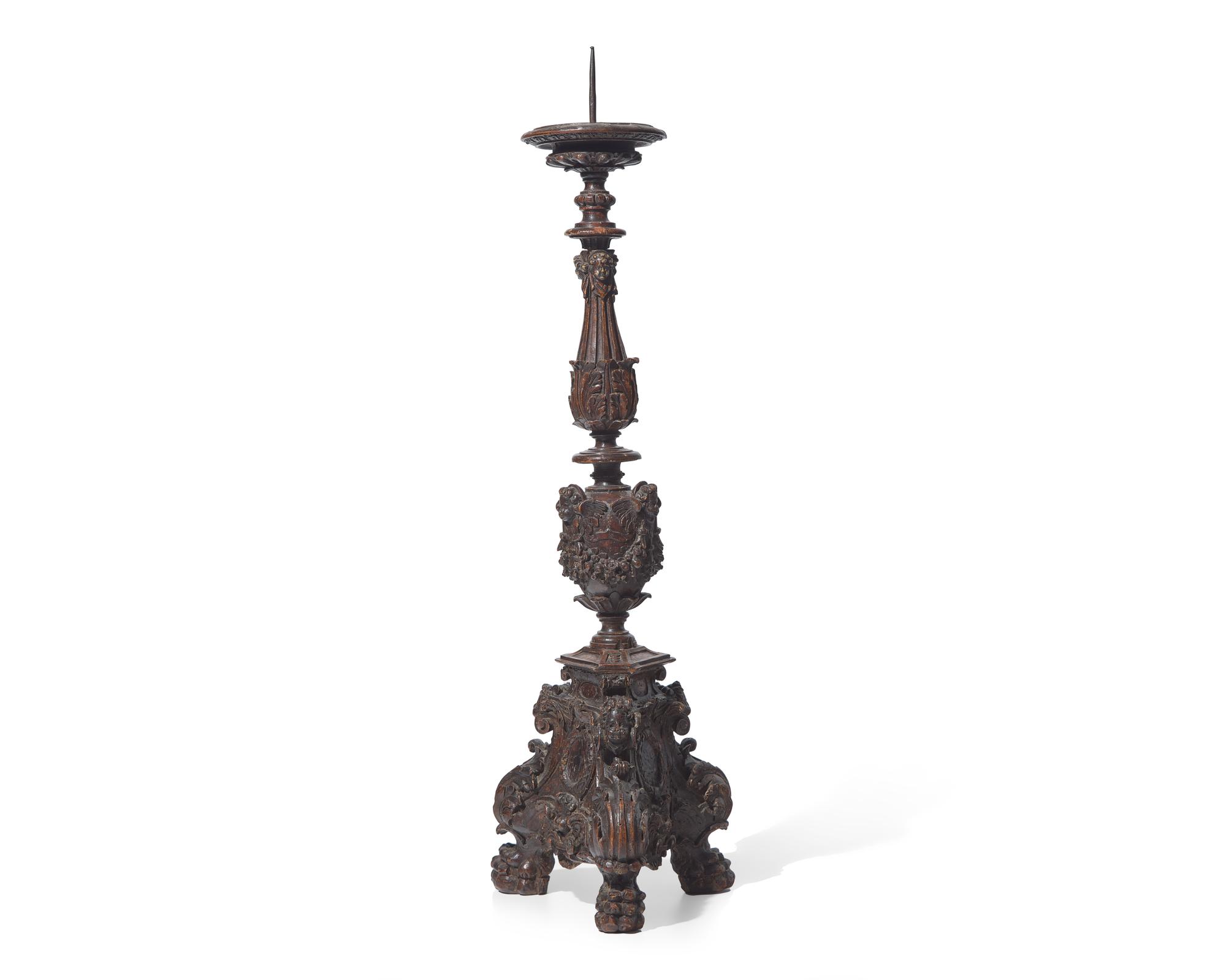 A large Italian Baroque carved walnut pricket candlestick, 16th century