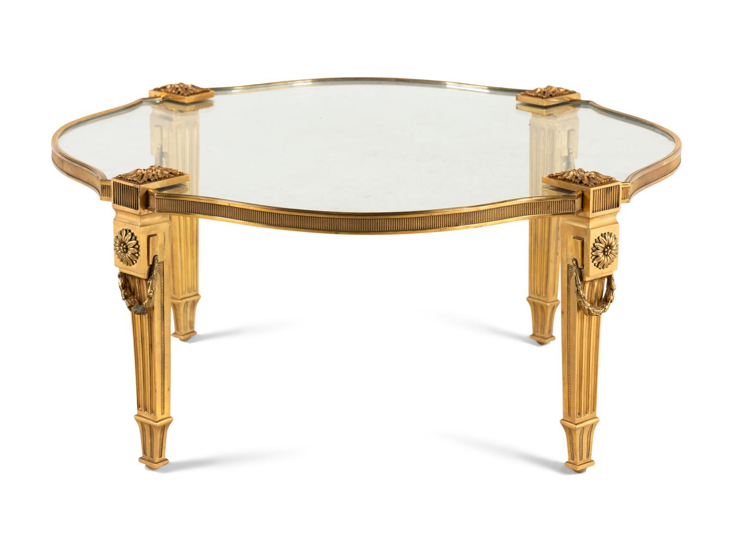 A Gilt Bronze and Glass Cocktail Table
