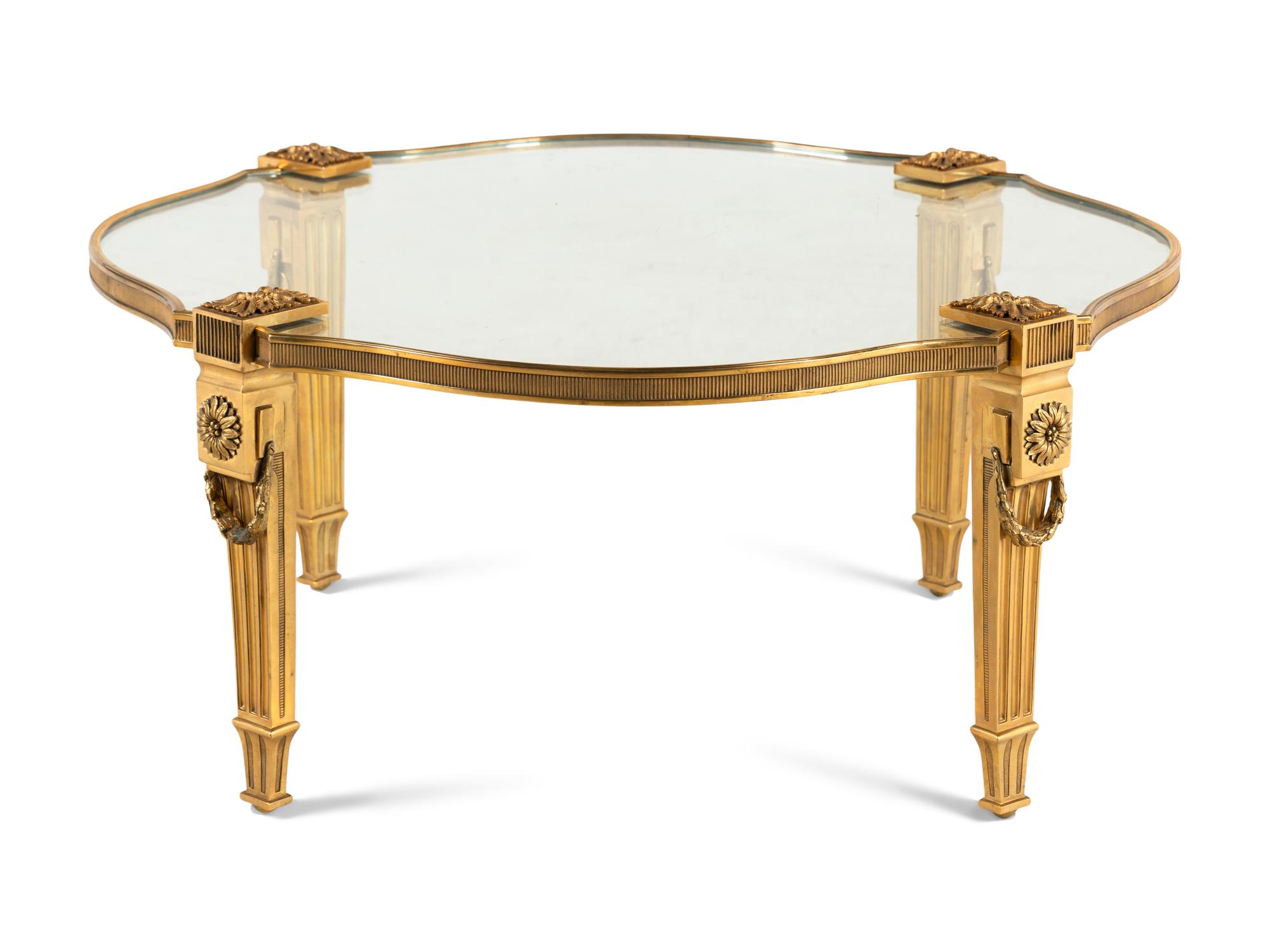 A Gilt Bronze and Glass Cocktail Table