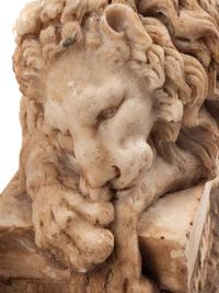 A Pair of Composition Marble Recumbent Lions