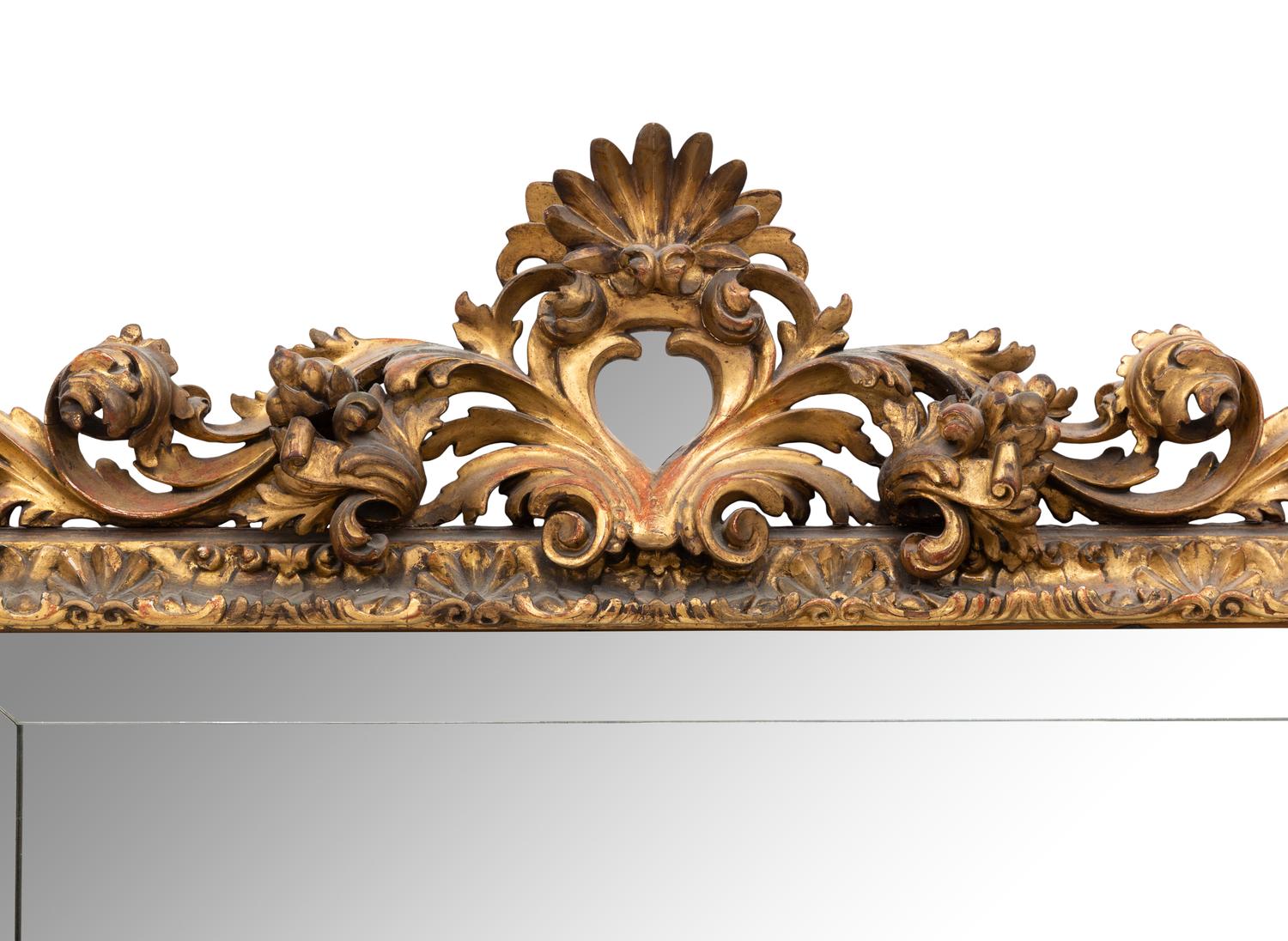 A Large Spanish Baroque Style Giltwood Mirror