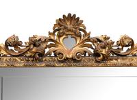 A Large Spanish Baroque Style Giltwood Mirror