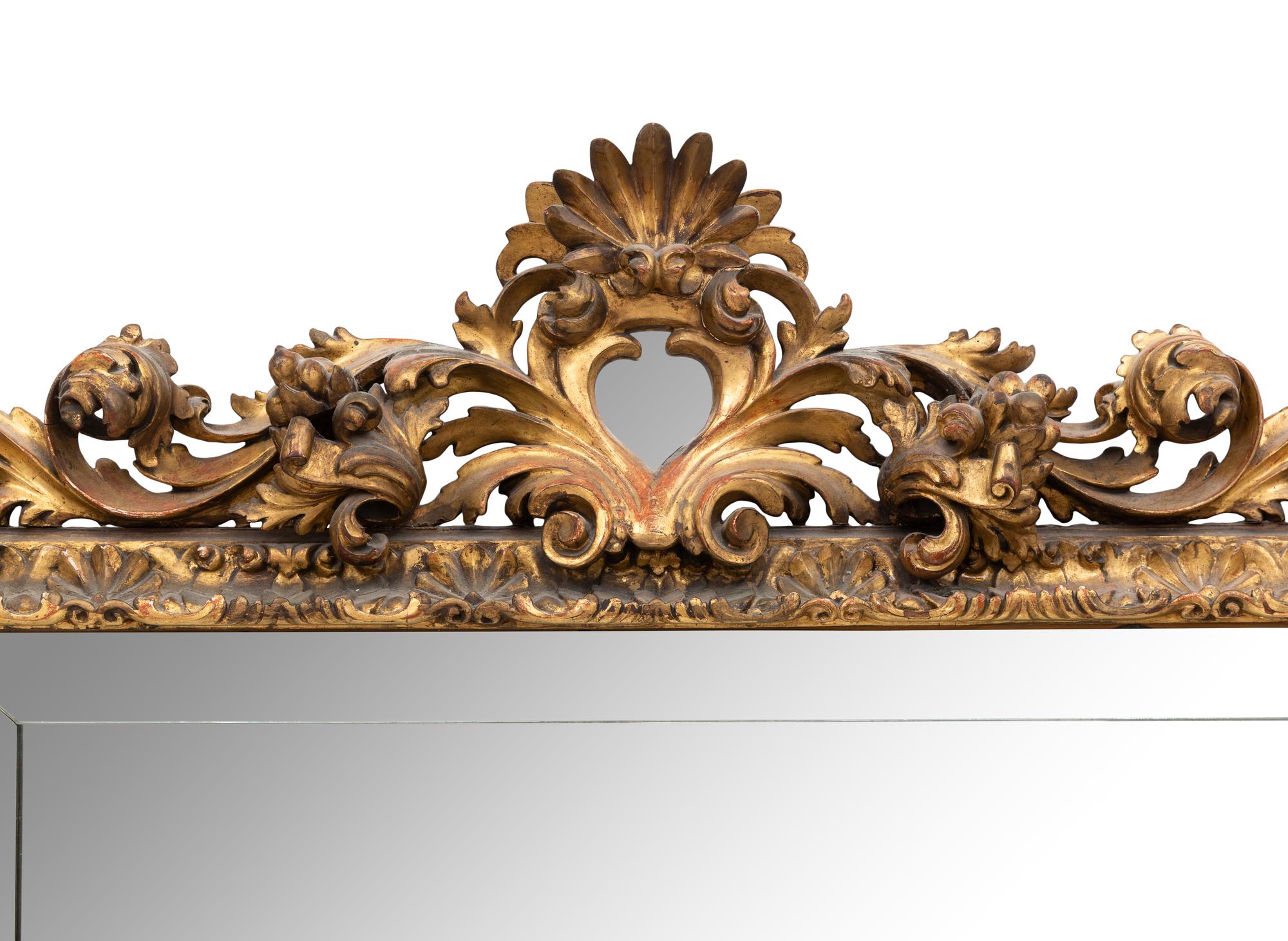 A Large Spanish Baroque Style Giltwood Mirror