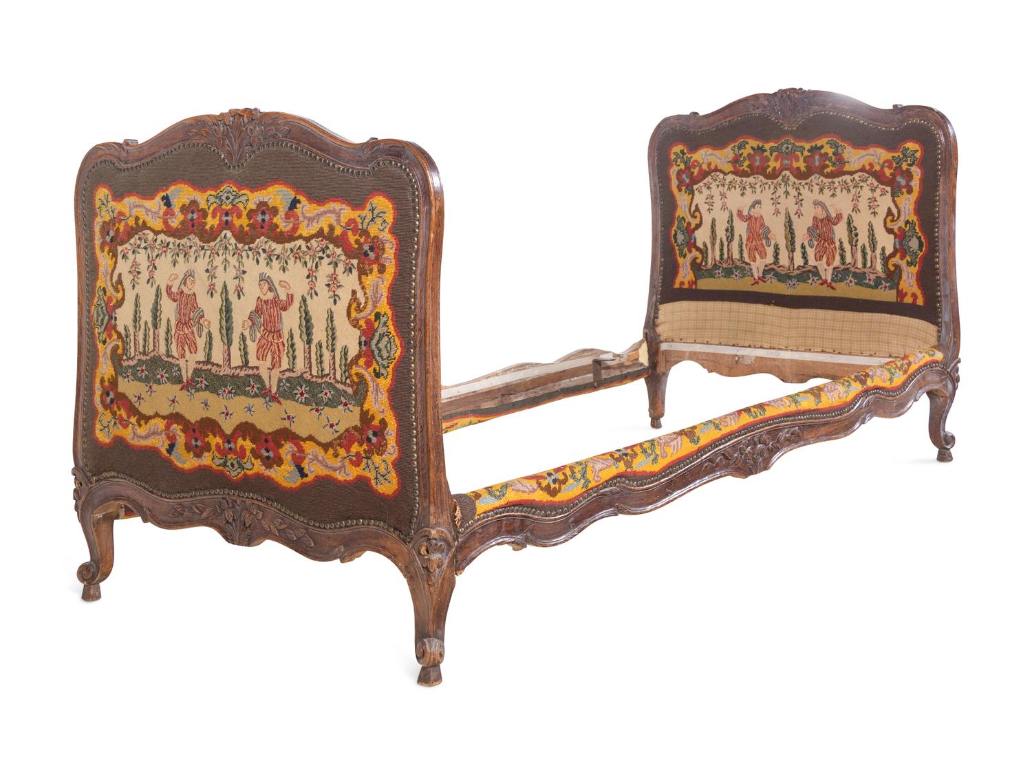 A French Provincial Carved Oak Bed with Needlepoint Upholstery