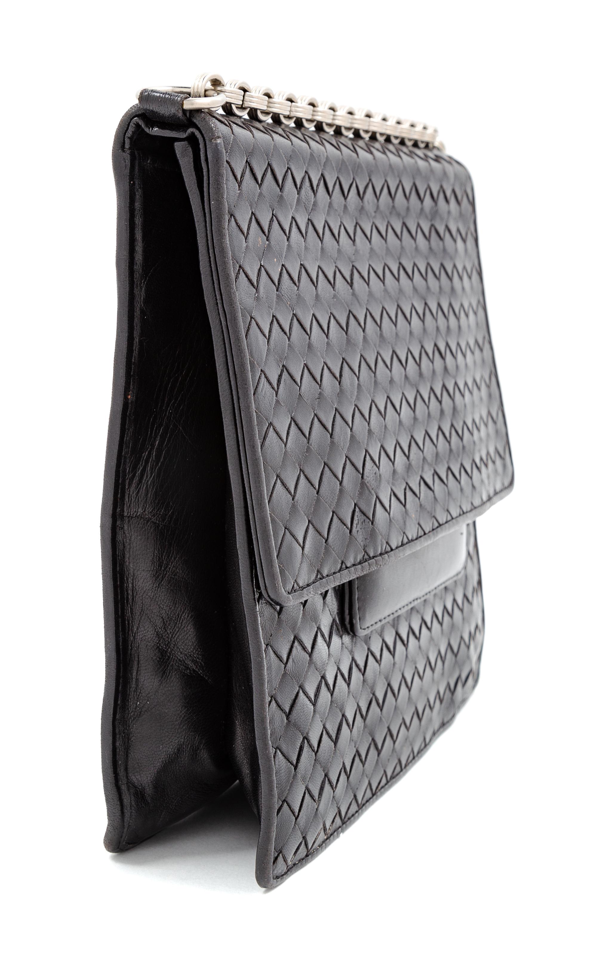 A Bottega Veneta Black Intrecciato Flap Handbag, 8.5" H x 9" W x 2.25" D; Strap drop: 13.5".
