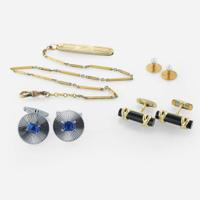 A collection of men's gold accessories