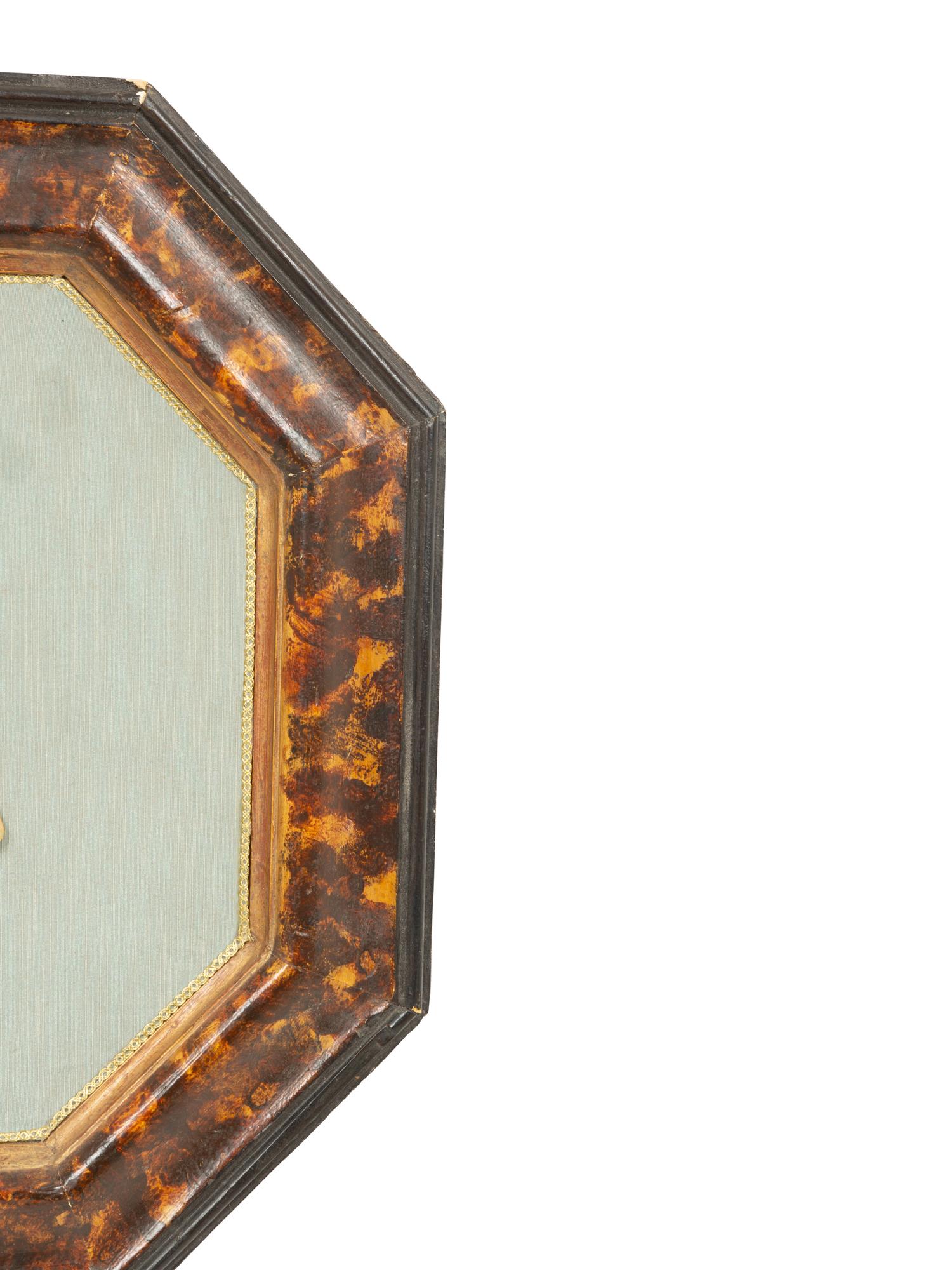 A Pair of Continental Faux Tortoiseshell Painted Framed Composition Plaques of Profile Busts