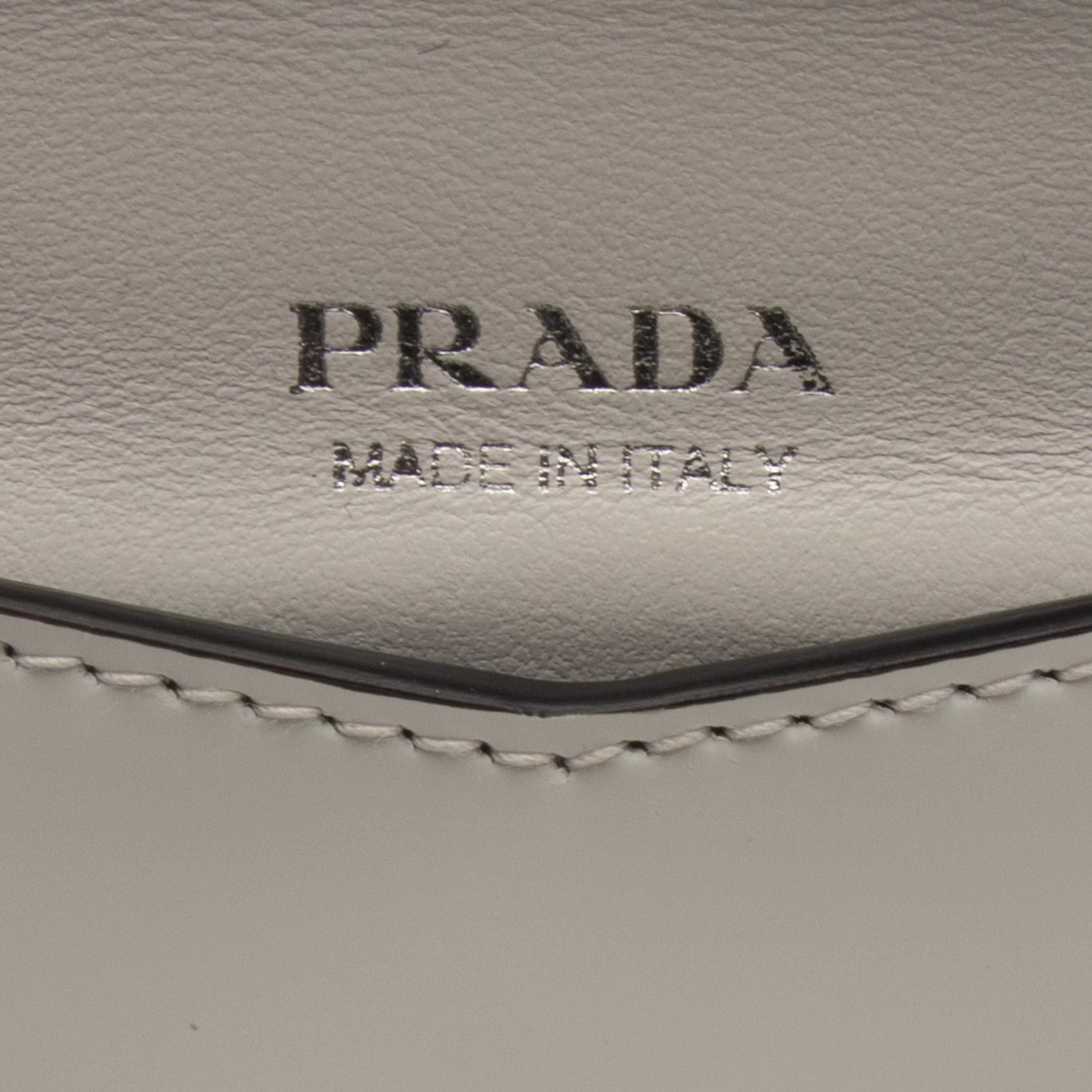 PRADA, WHITE LEATHER WRISTLET CLUTCH