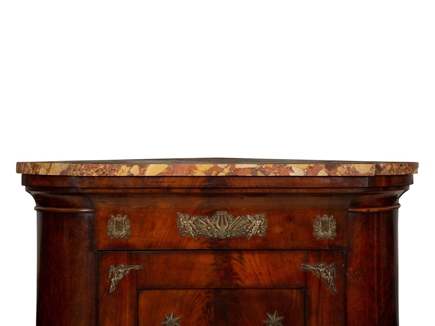An Empire Gilt Bronze Mounted Mahogany Encoignure with a Brèche d'Alep Marble Top