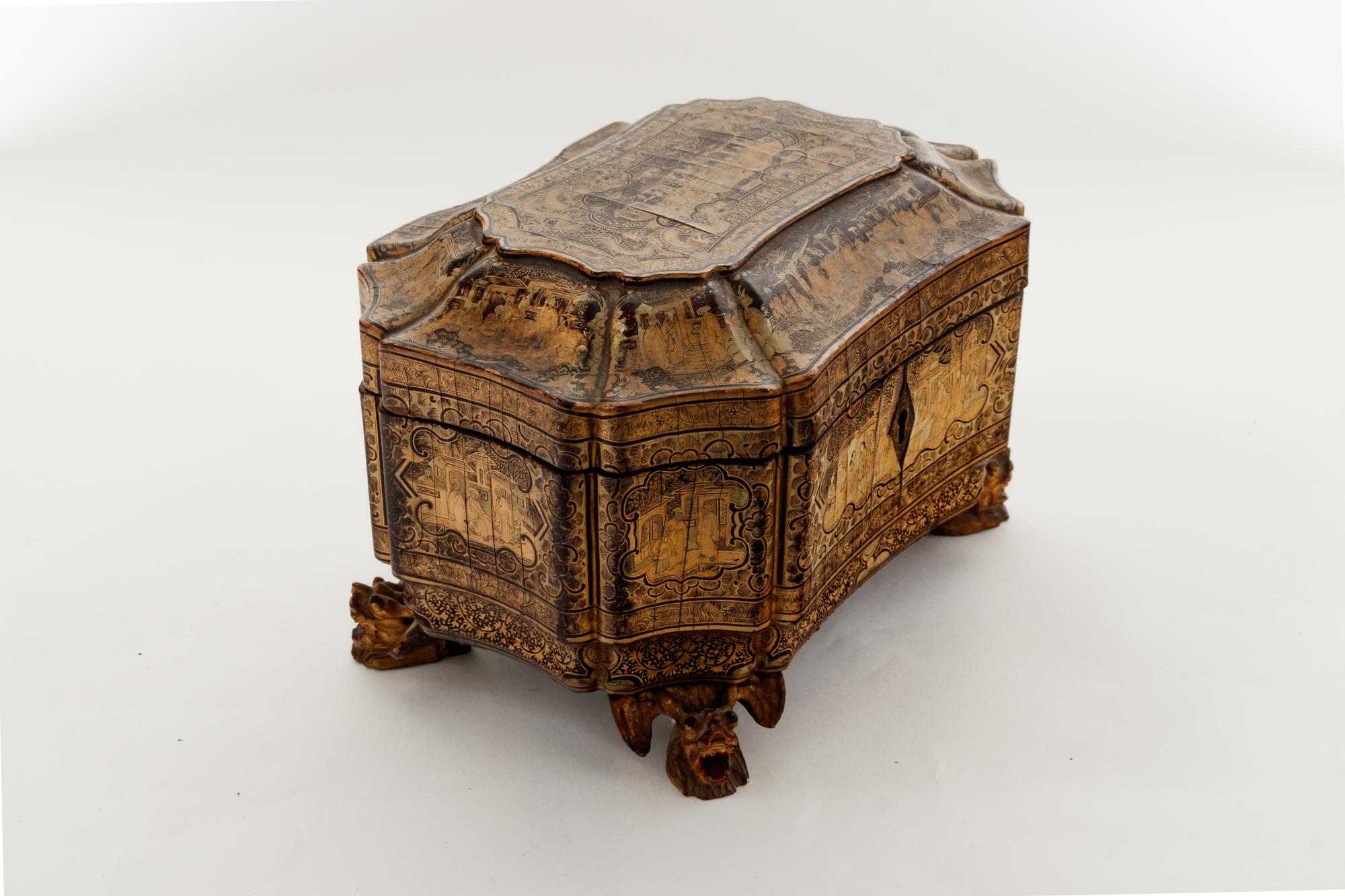 A Chinese Export Gilt Decorated Black Lacquer Tea Caddy