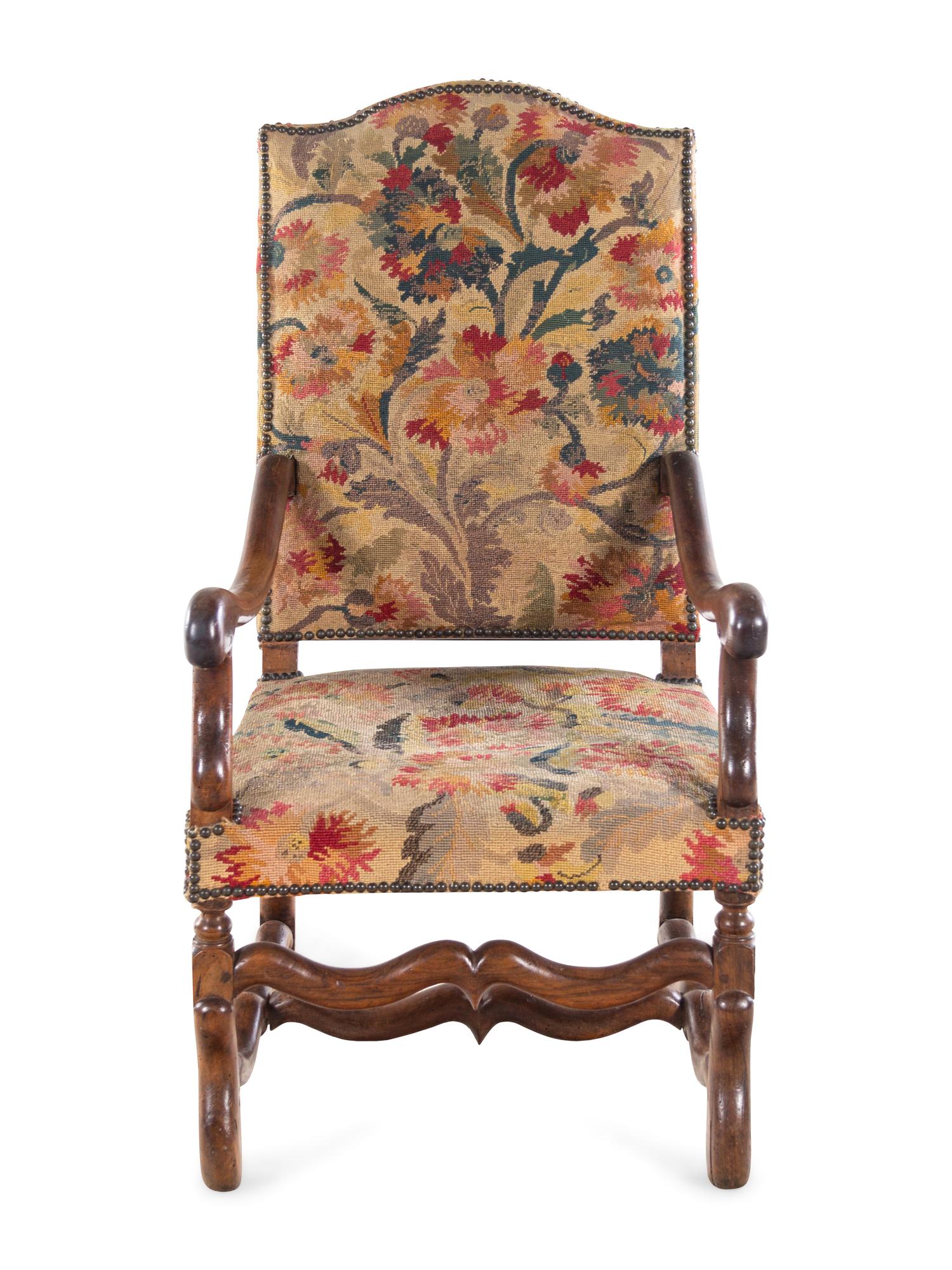 A Louis XIV Walnut Fauteuil à la Reine with Needlework Upholstery