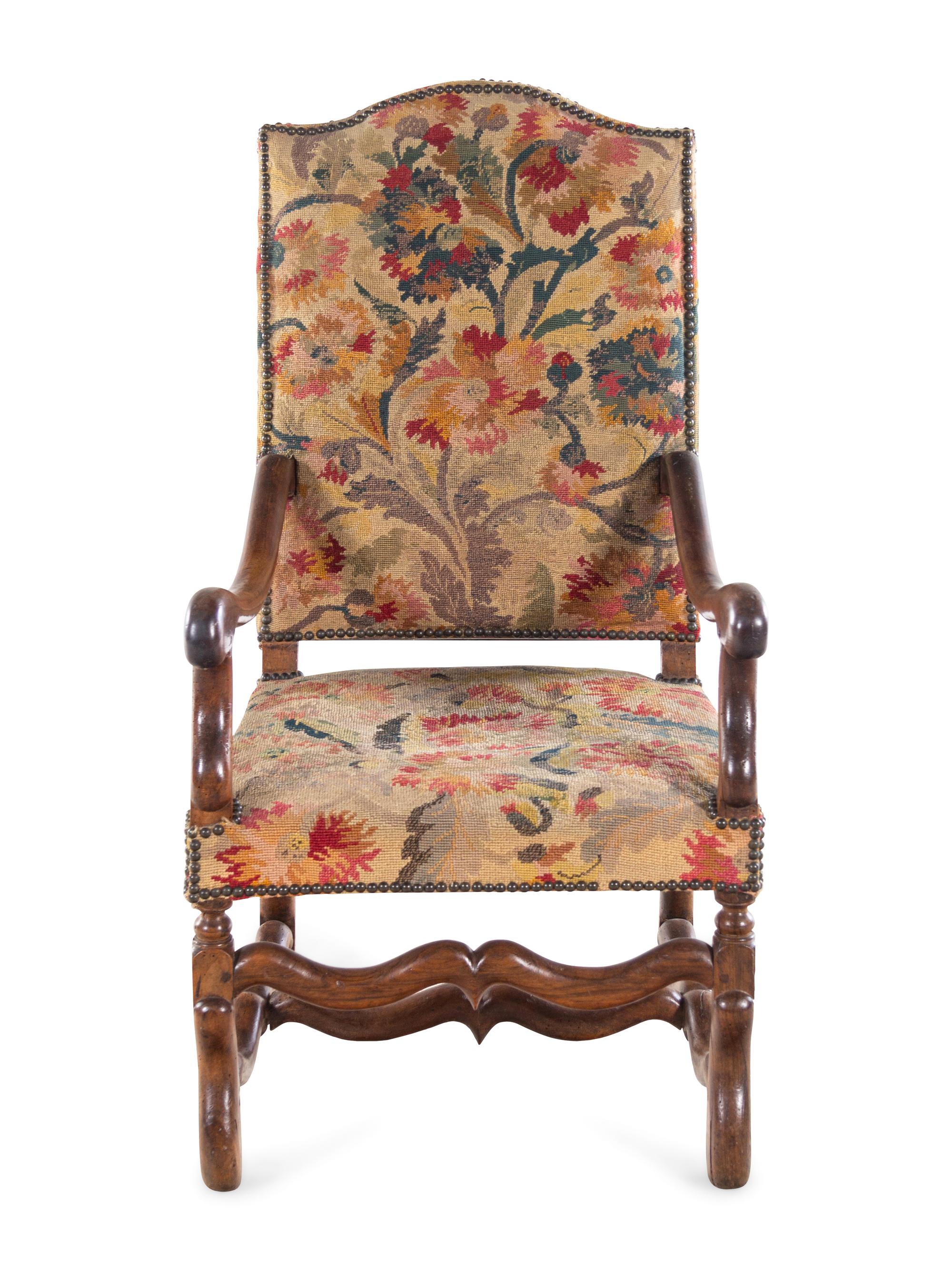 A Louis XIV Walnut Fauteuil à la Reine with Needlework Upholstery