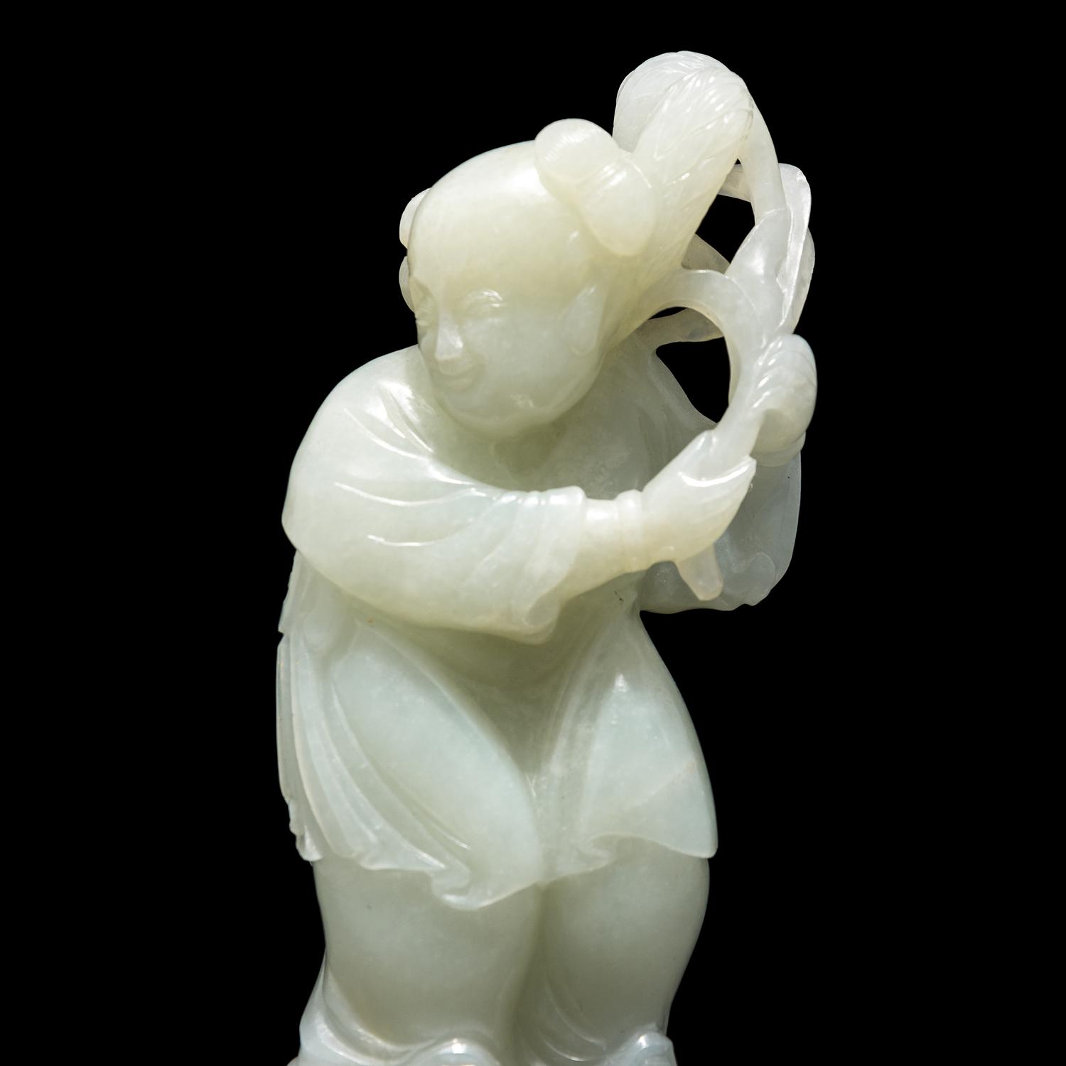 A Chinese Pale Celadon Jade Figure of a Boy, 18th-19th Century 清中期 青白玉 持蓮 童子