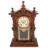 A Carved Rosewood Welch 'Patti VP' Shelf Clock