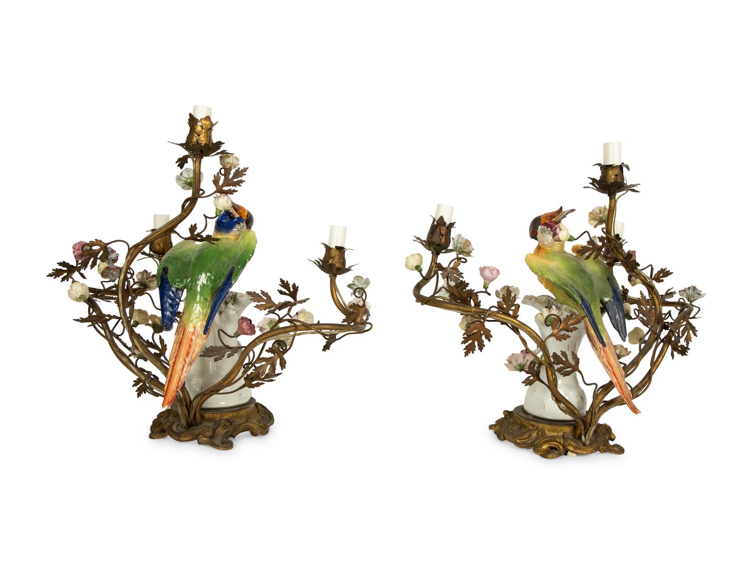 A Near Pair of French Porcelain, Gilt Bronze and Tole Lamps Mounted with Porcelain Parrots — LATE 19TH/EARLY 20TH CENTURY