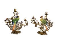 A Near Pair of French Porcelain, Gilt Bronze and Tole Lamps Mounted with Porcelain Parrots — LATE 19TH/EARLY 20TH CENTURY