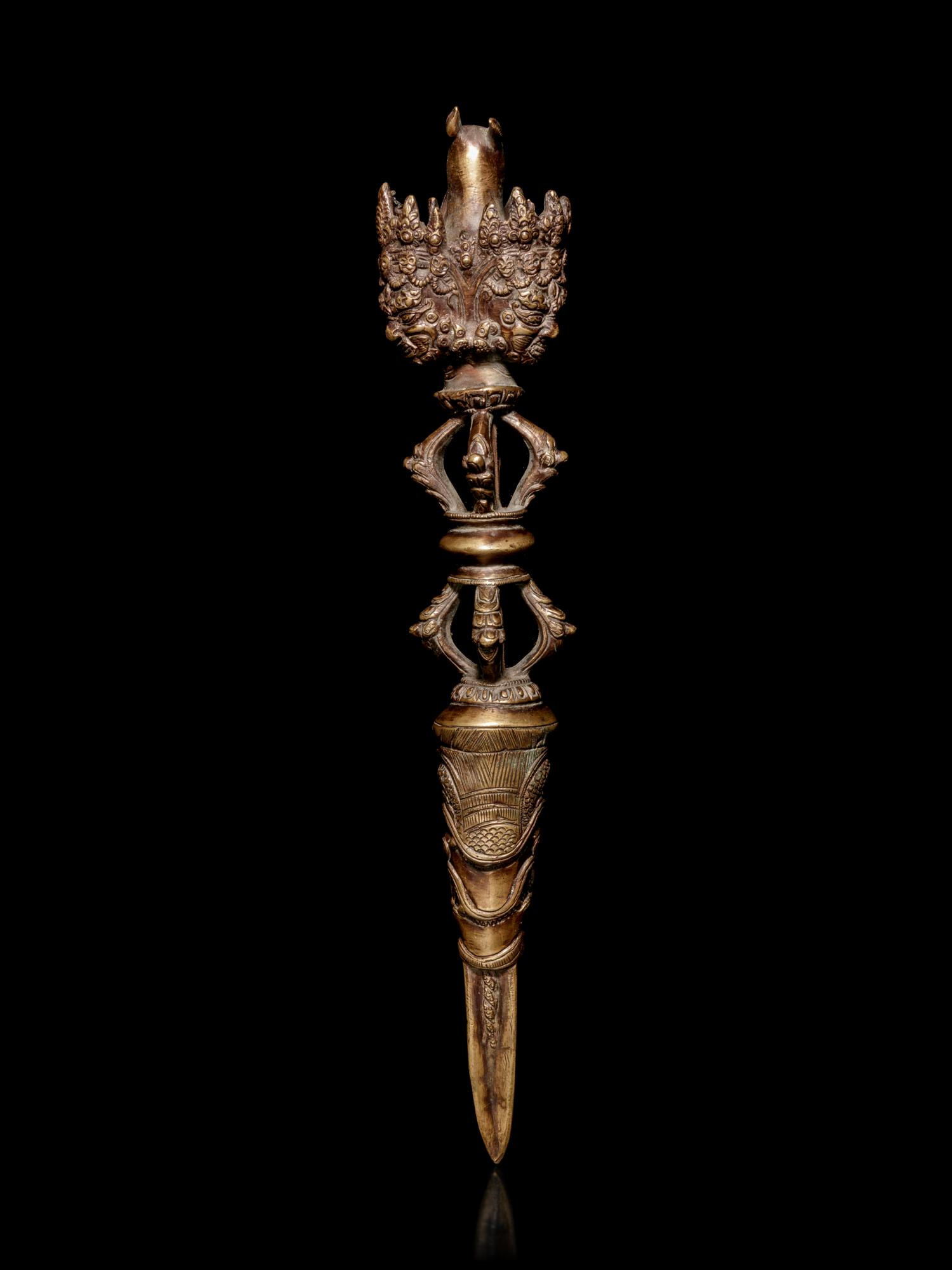 A Tibetan Gilt Bronze Phurba
