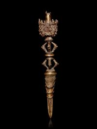 A Tibetan Gilt Bronze Phurba