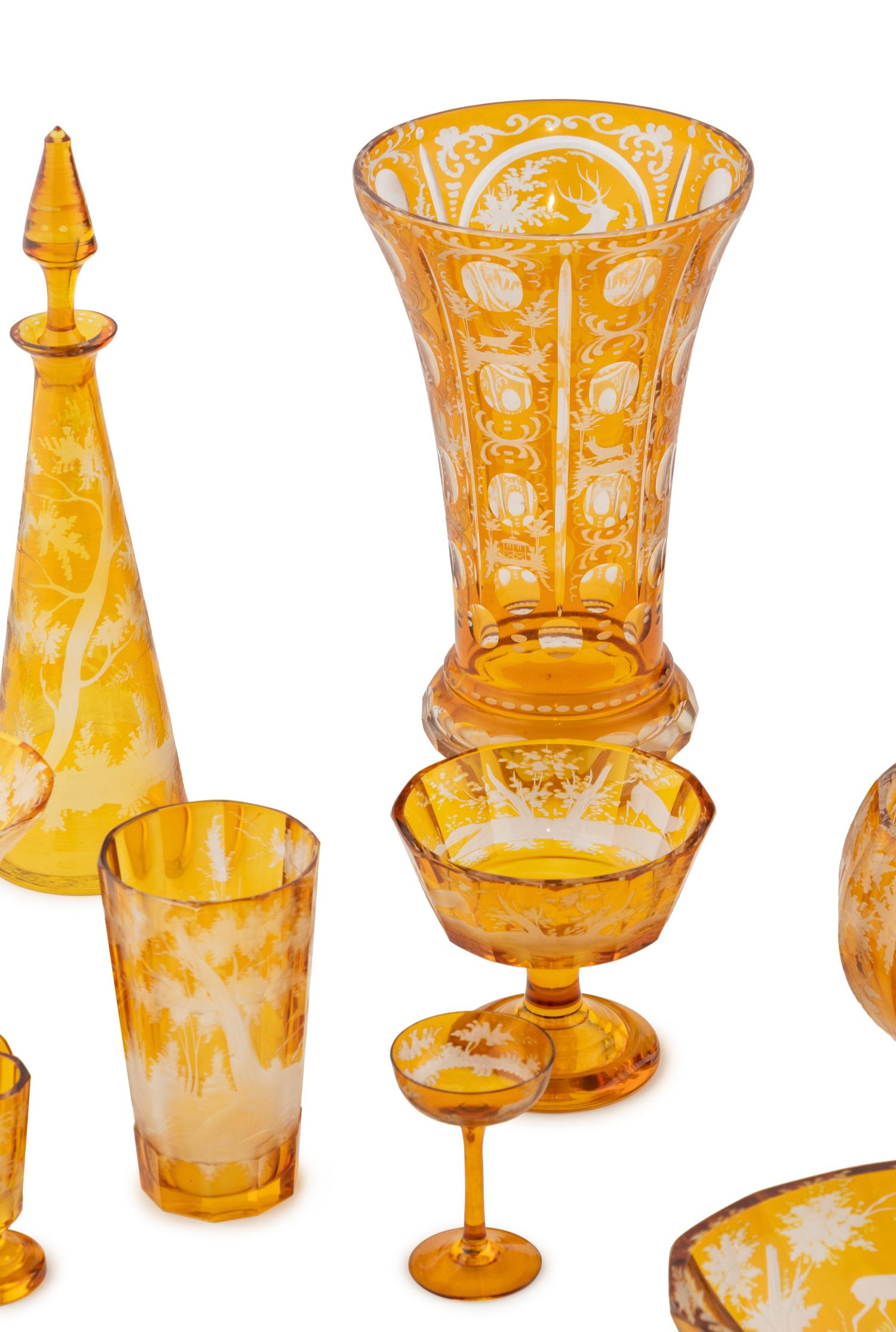 A Bohemian Amber Etched Glass Table Service