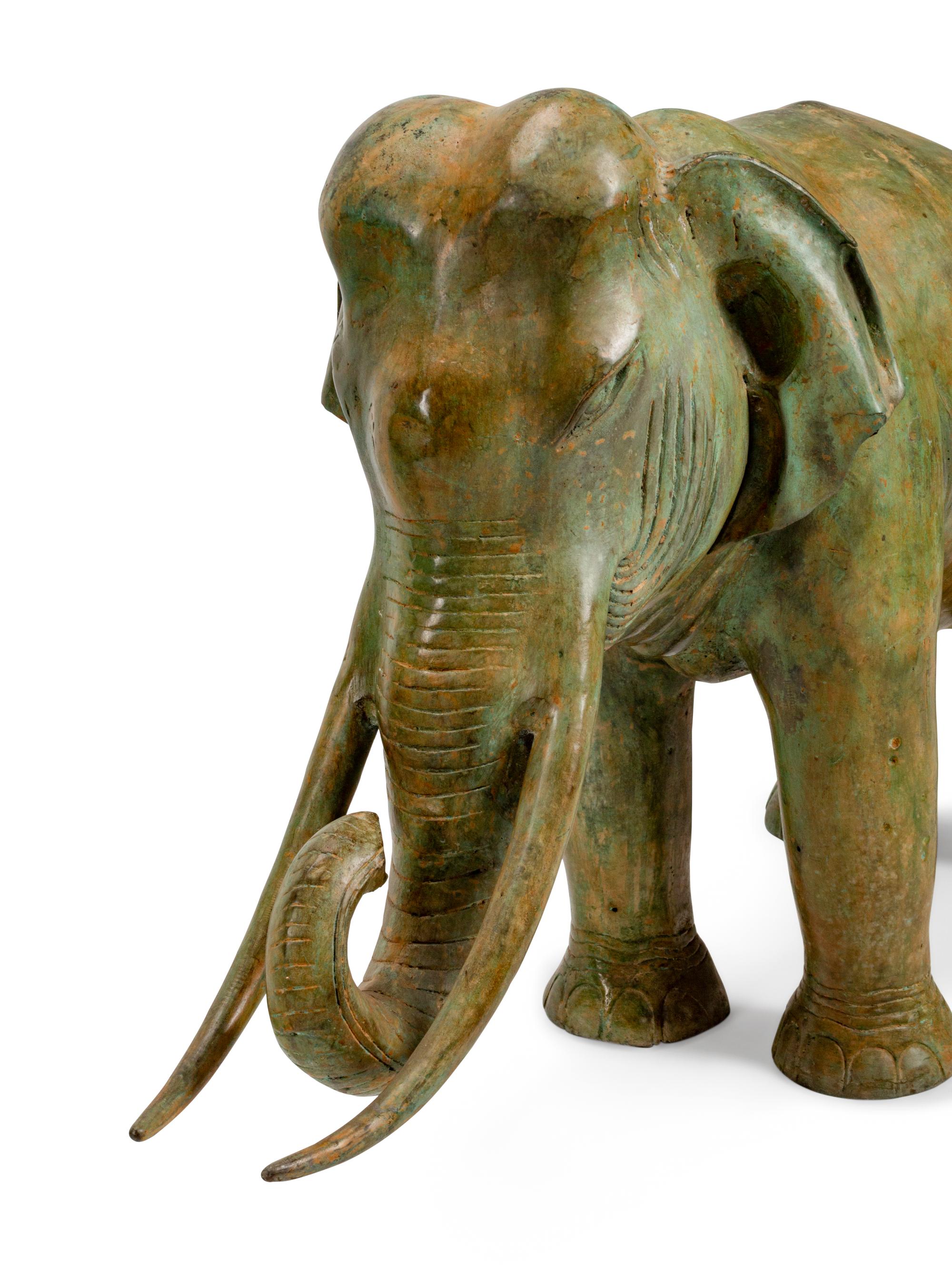 A Large Pair of Patinated Bronze Elephants