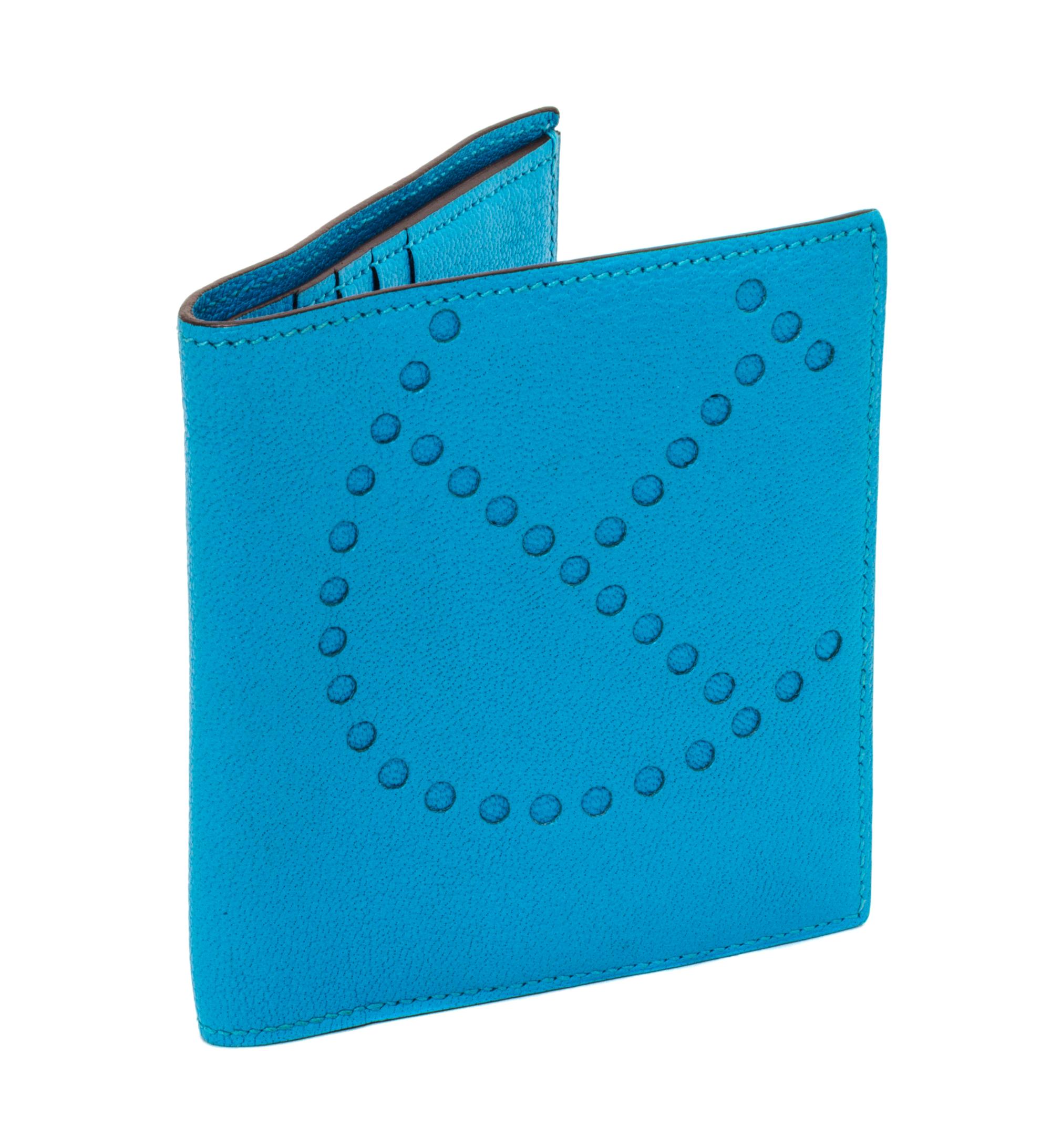 An Hermes Saint Cyr Blue Leather Evelyne Wallet, 4" x 4" x .25".