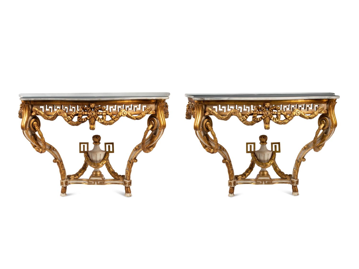 A Pair of Italian Neoclassical Style White Painted and Parcel Gilt Marble-Top Console Tables