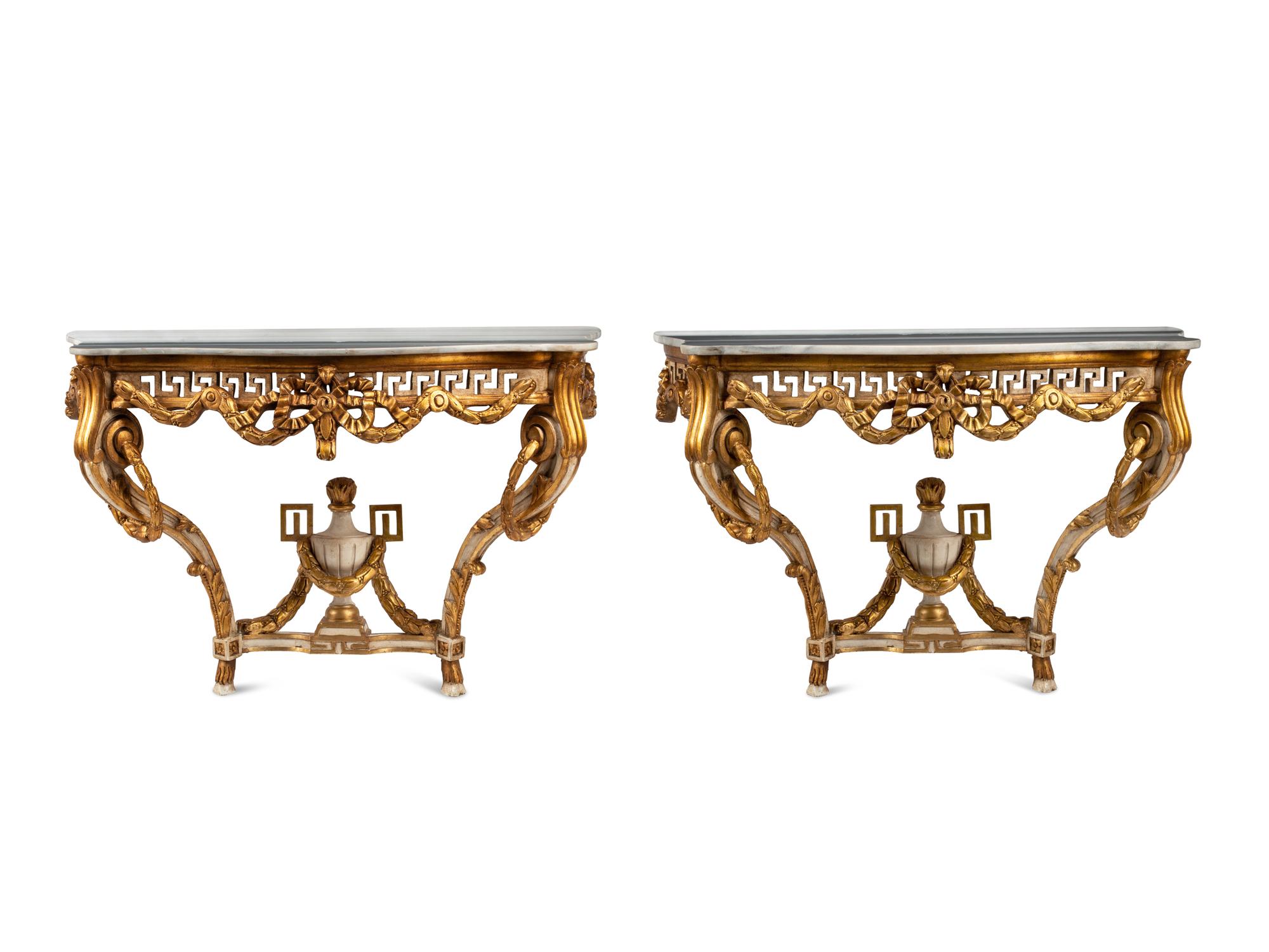A Pair of Italian Neoclassical Style White Painted and Parcel Gilt Marble-Top Console Tables
