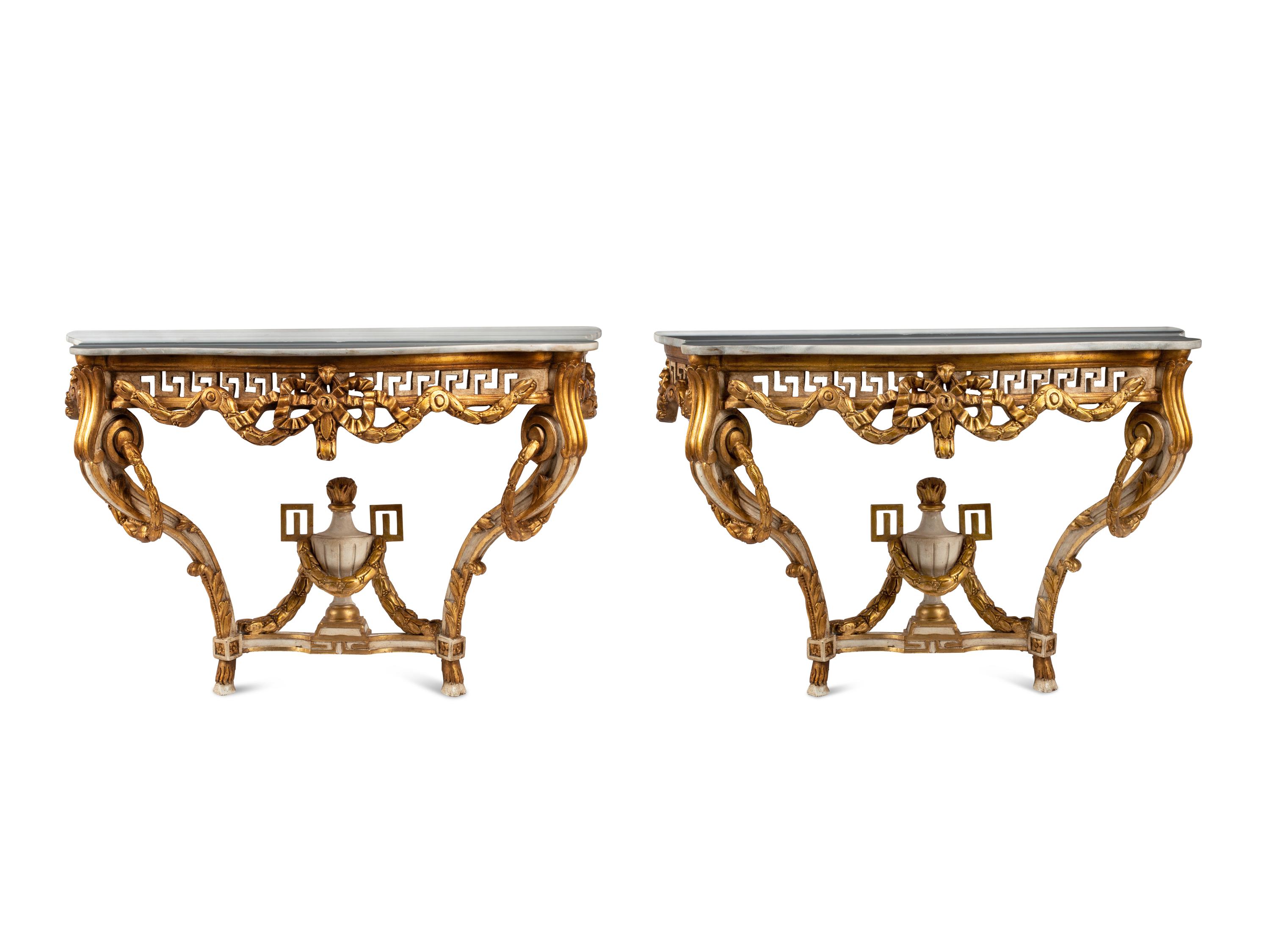 A Pair of Italian Neoclassical Style White Painted and Parcel Gilt Marble-Top Console Tables
