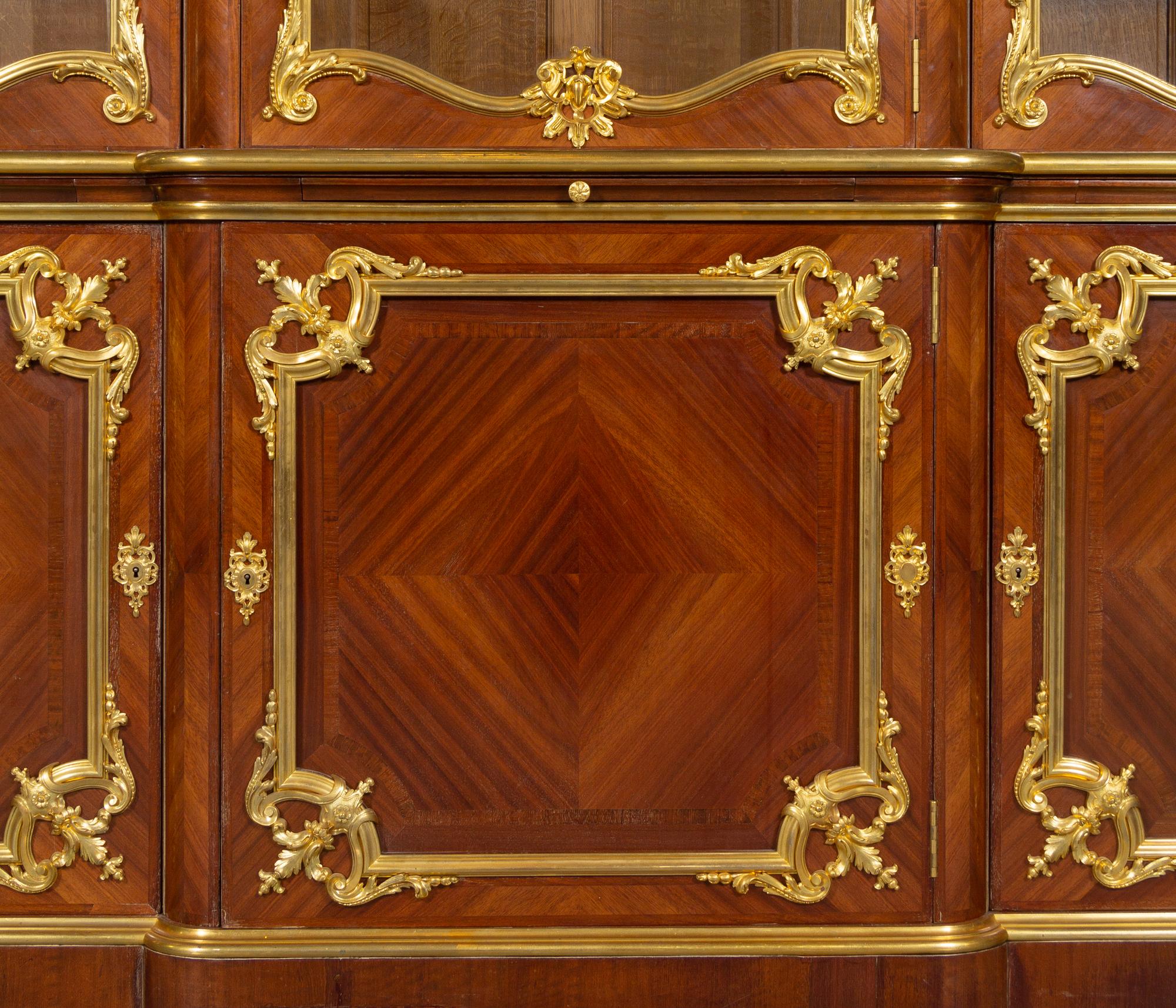 A Louis XV Style Gilt Bronze Mounted Kingwood Breakfront Cabinet
