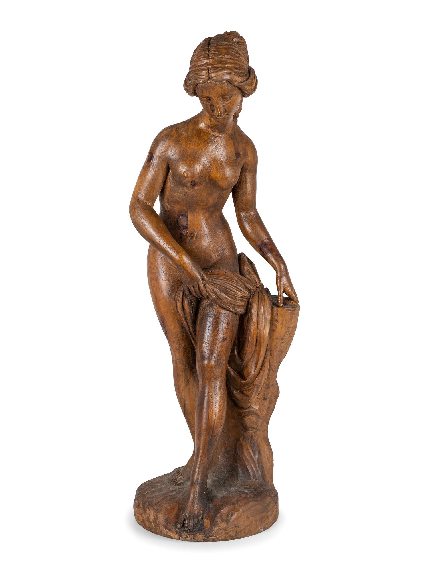A Classically Inspired Carved Wooden Sculpture of a Standing Nude Female