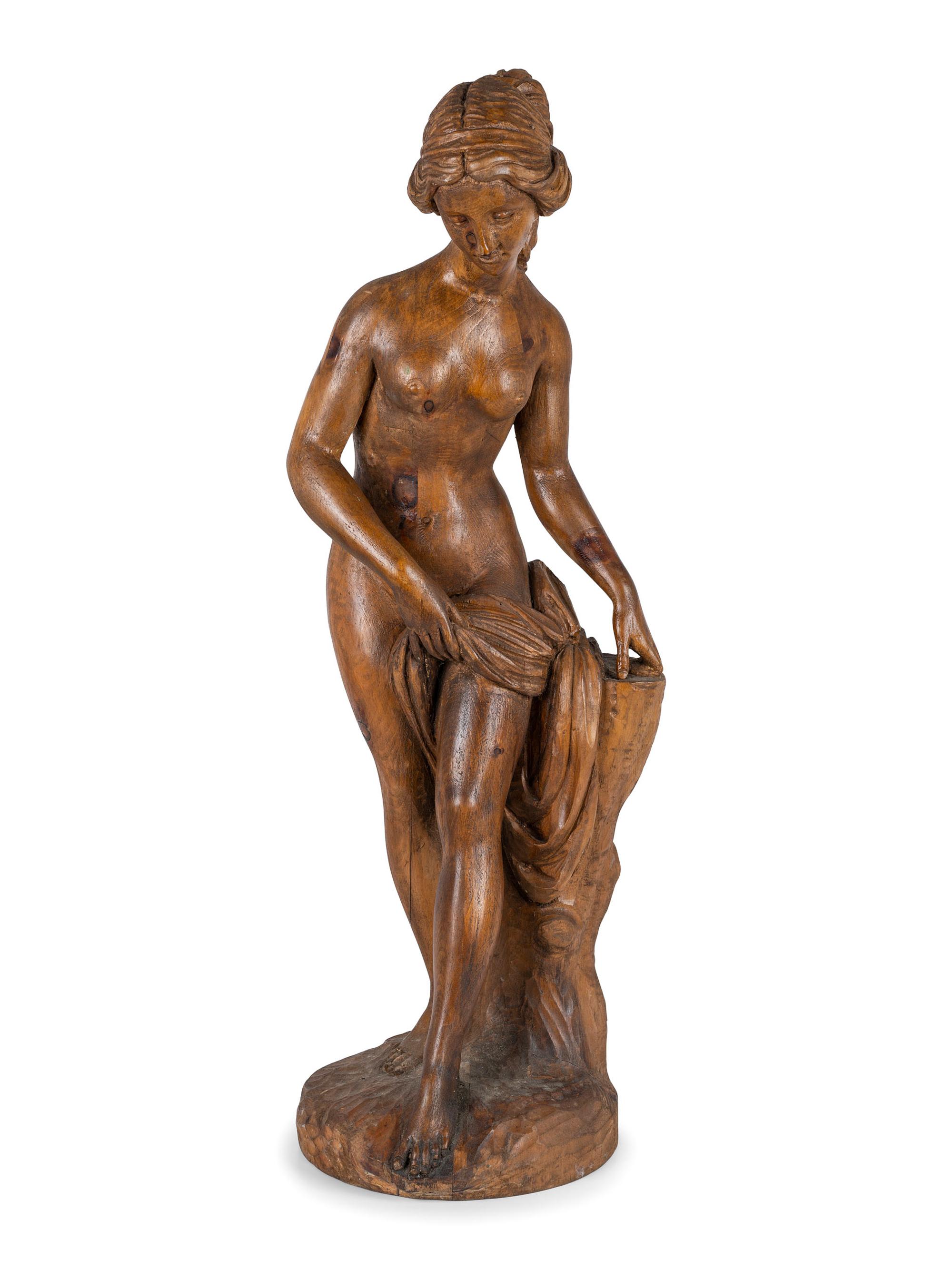 A Classically Inspired Carved Wooden Sculpture of a Standing Nude Female
