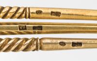 A Group of Three Russian Silver-Gilt and Enamel Spoons, Mark of 11th Artel, Moscow, early 20th century, each having an enameled finial,