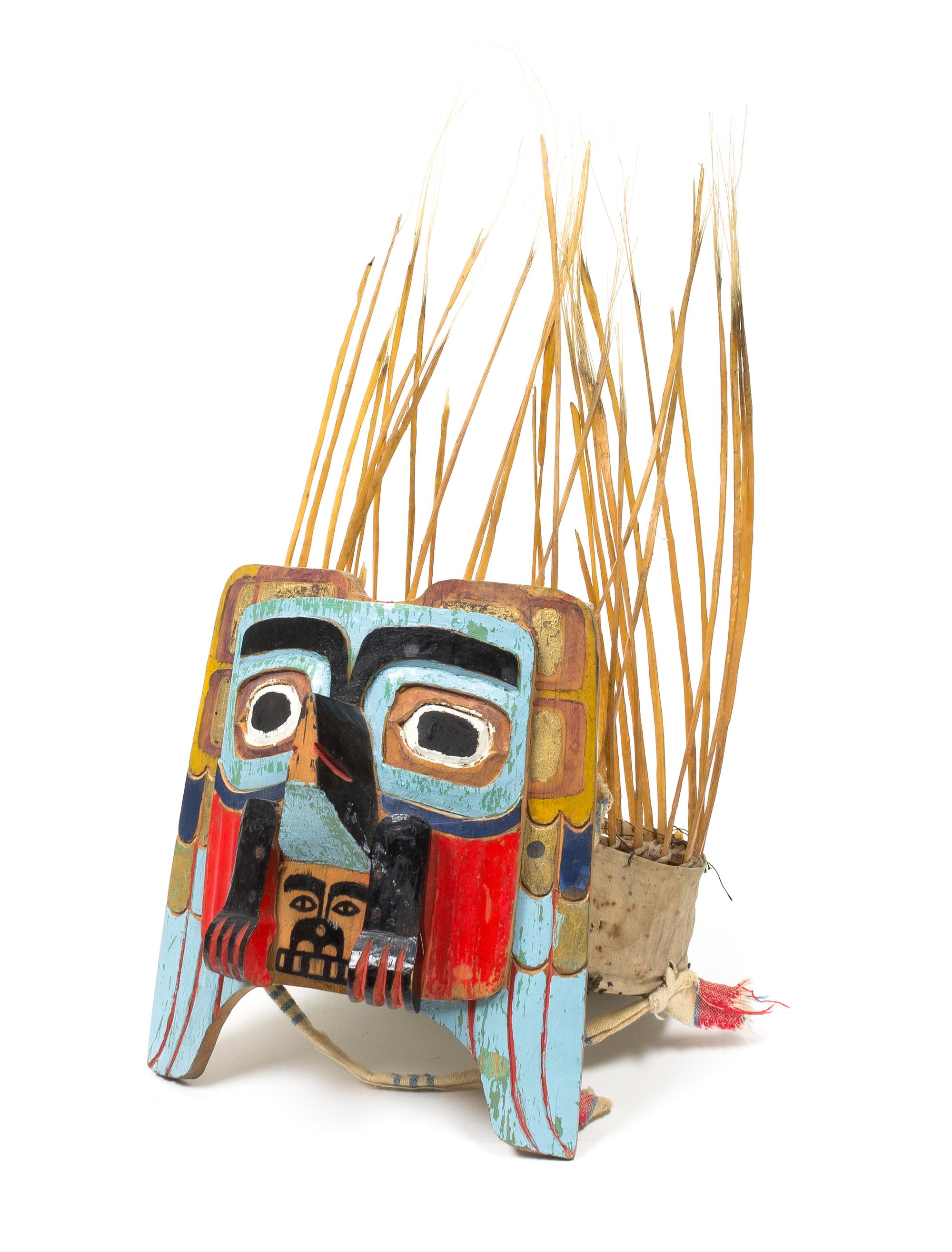 A Nuu-chah-nulth Painted Wood Headdress Height 19 1/2 x width 9 x depth 8 3/4 inches.