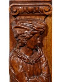 A Pair of Carved Oak Figural Pilasters