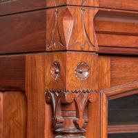 A glazed walnut double bookcase Attributed to Frank Furness (American, 1839-1912) and Daniel Pabst (American, b. Germany, 1826-1910), USA, circa 1875-1885