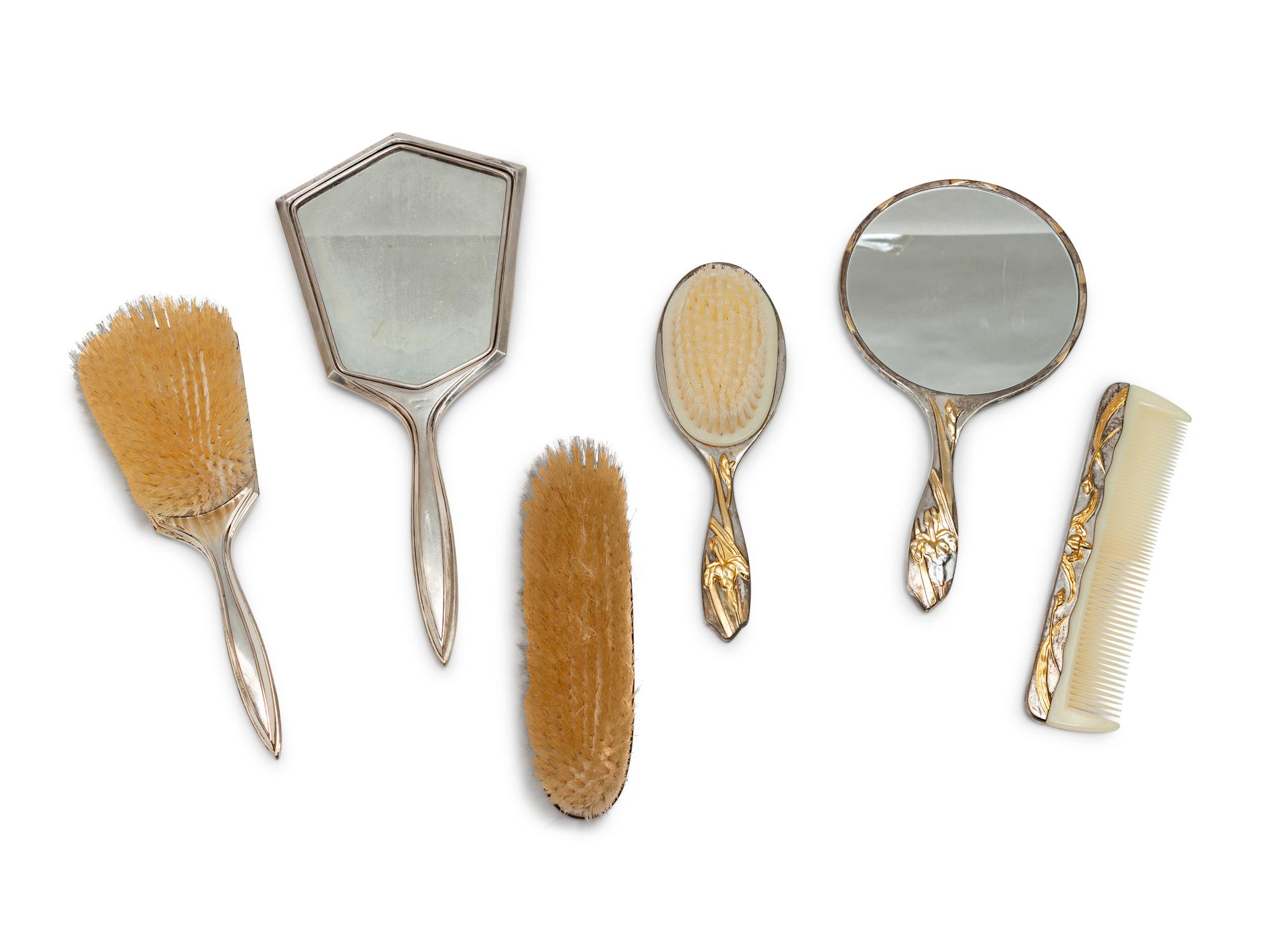 A Group of Art Nouveau Silver Dresser Objects Including Mirrors, Brushes and Combs