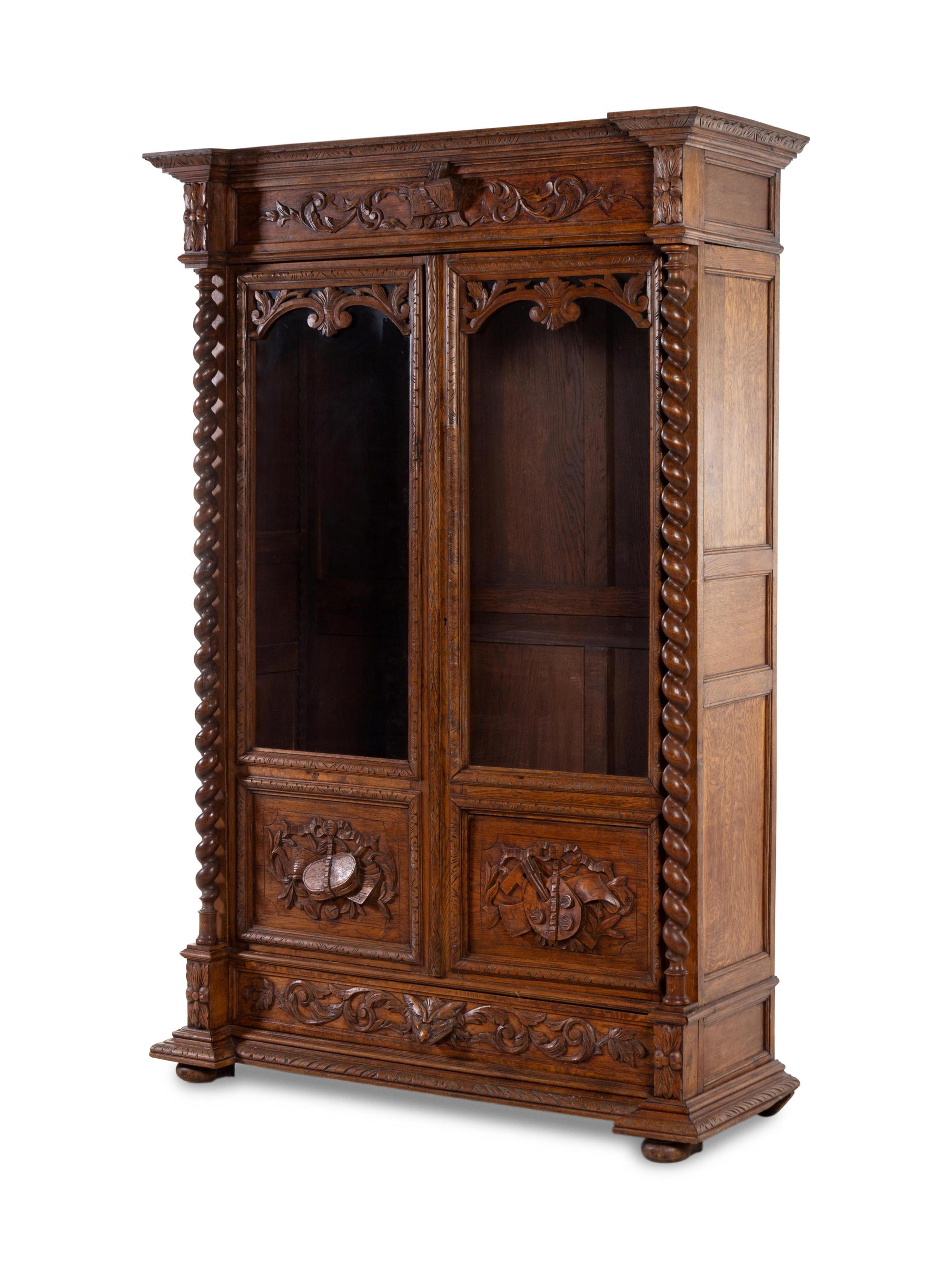 A Renaissance Revival Carved Oak Armoire