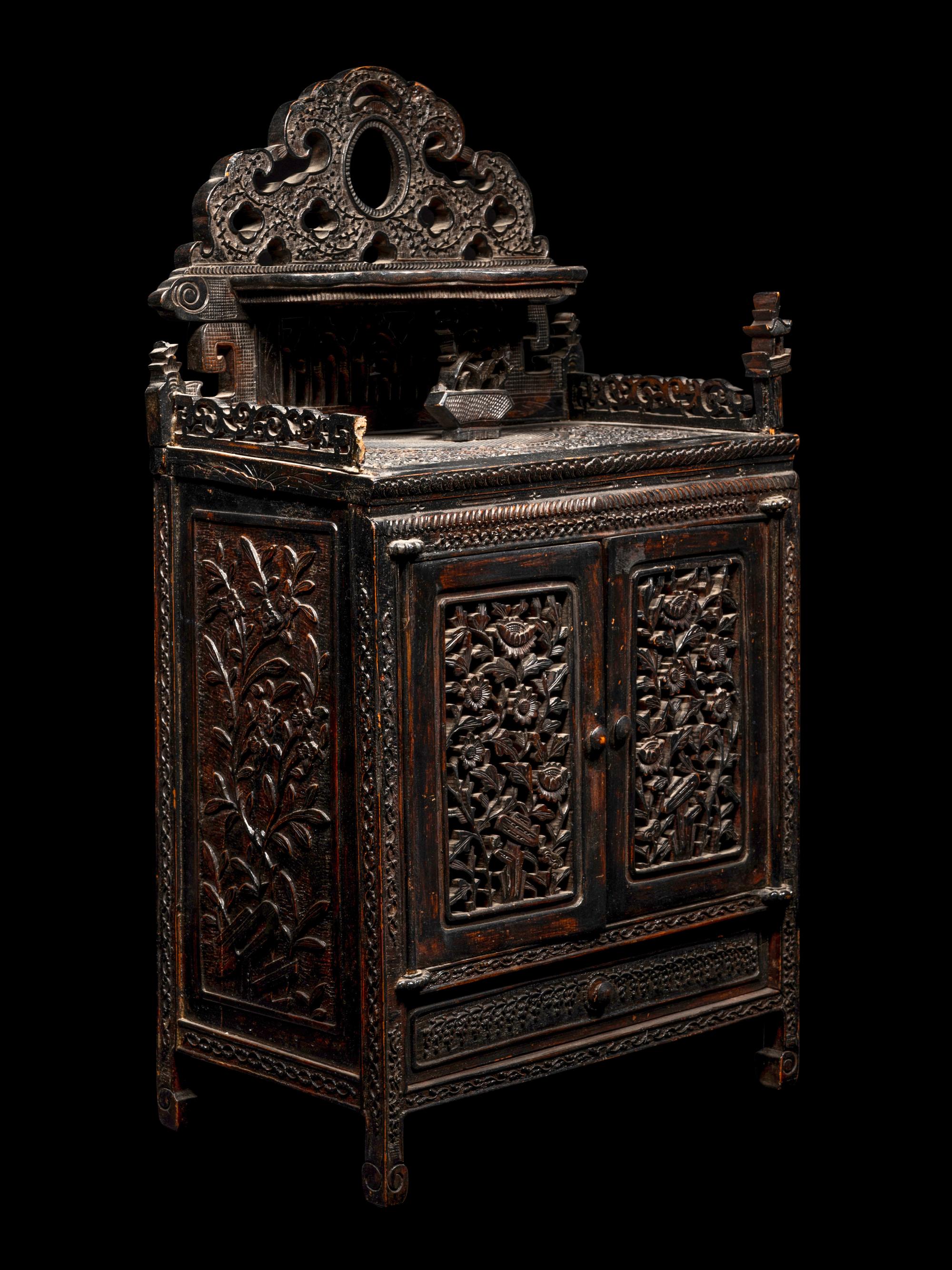 A Chinese Export Carved Hardwood Cabinet