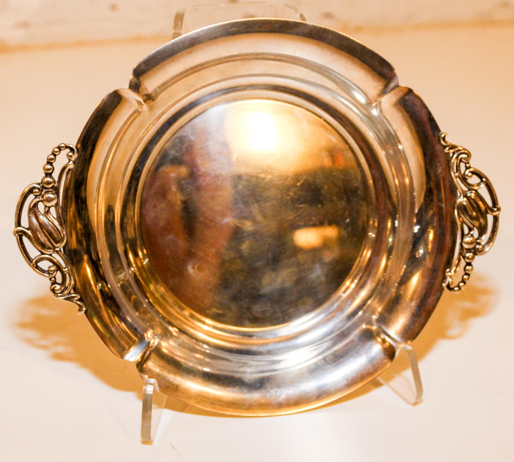 An American Silver Dish, Shreve & Co., San Francisco, CA, of lobed circular form, having stylized floral bud handles.
