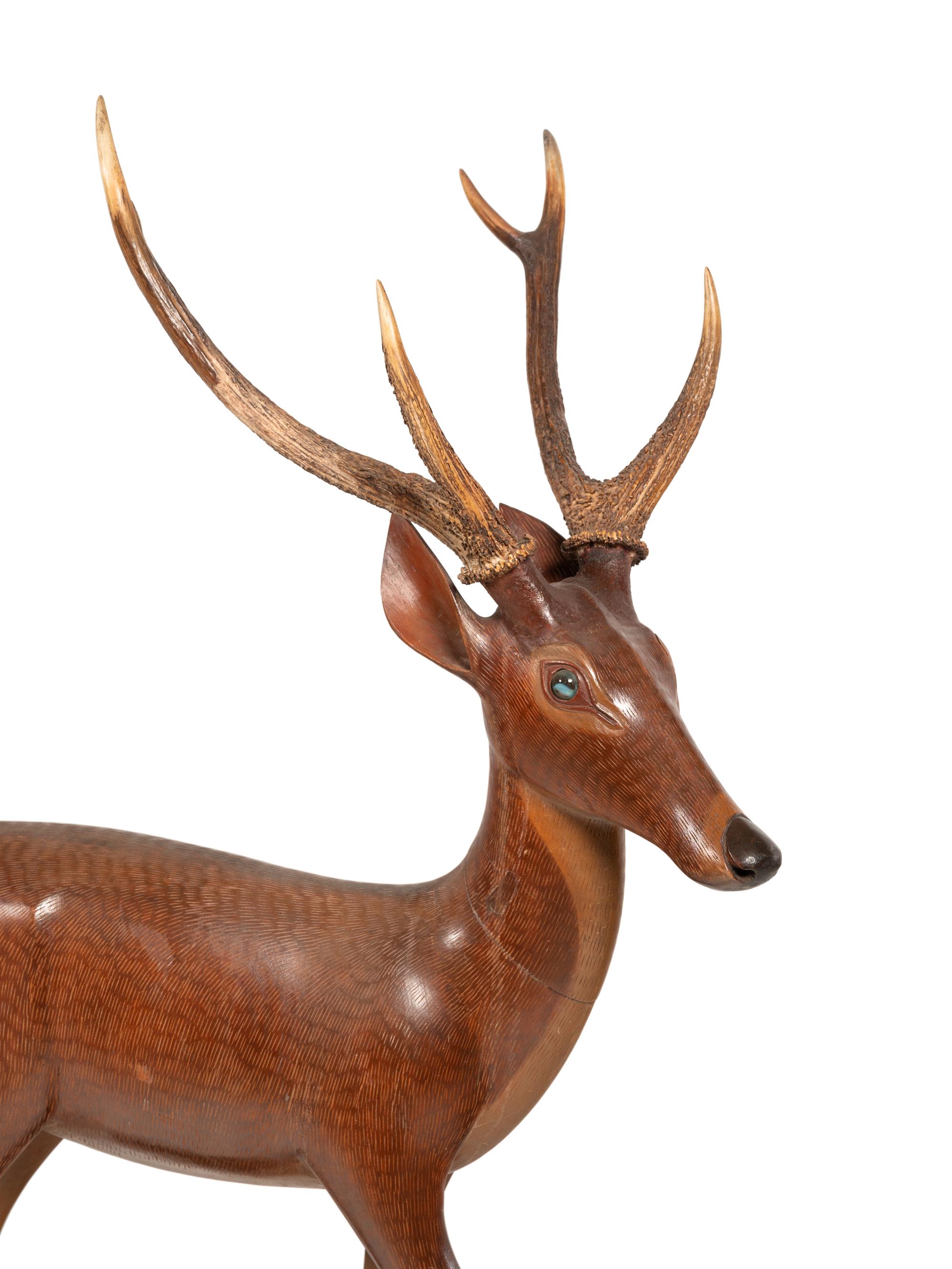 A Pair of Carved Fruitwood and Antler Mounted Models of Deer