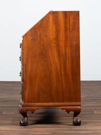 A Chippendale Carved Mahogany Reverse Serpentine Block-Front Desk