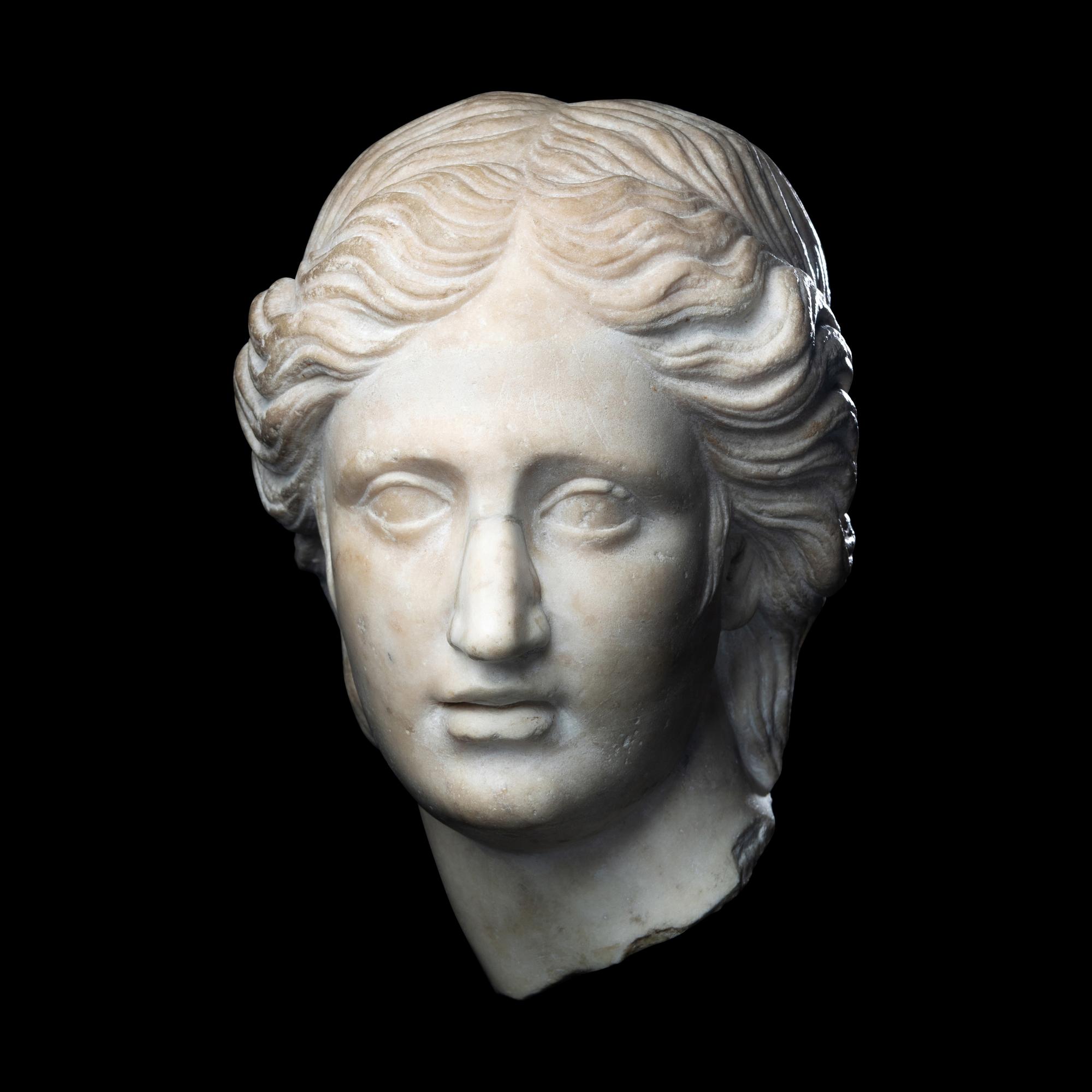 A Roman Marble Head of a Goddess or Youthful God