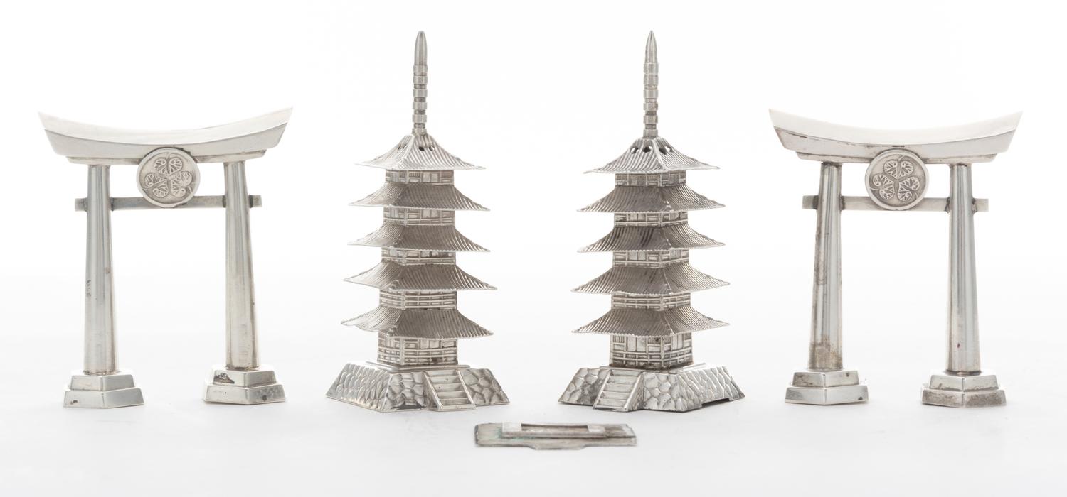 Four Japanese Style Silver Castors, , comprising two examples in the form of a torii gate and two examples in the form of a pagoda.