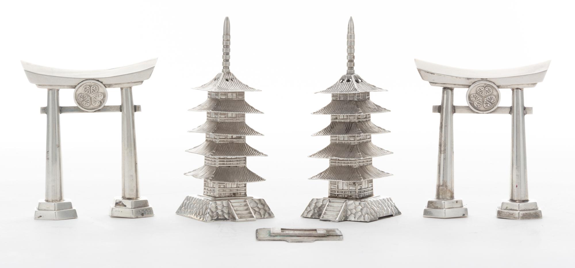 Four Japanese Style Silver Castors, , comprising two examples in the form of a torii gate and two examples in the form of a pagoda.