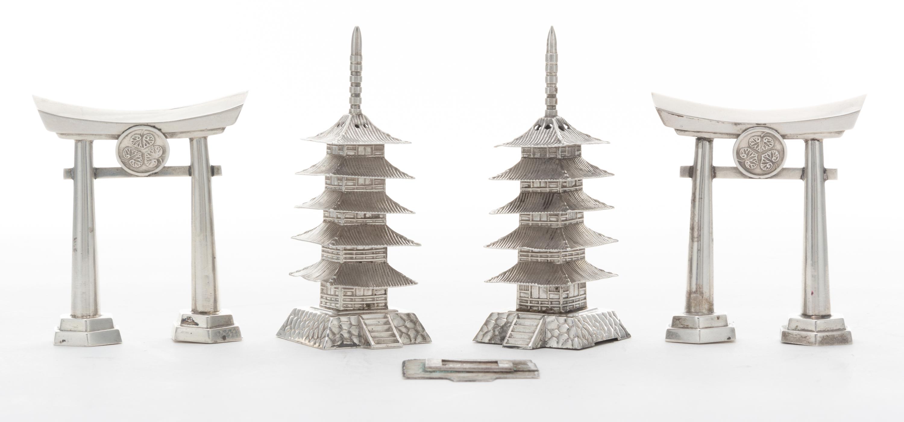 Four Japanese Style Silver Castors, , comprising two examples in the form of a torii gate and two examples in the form of a pagoda.