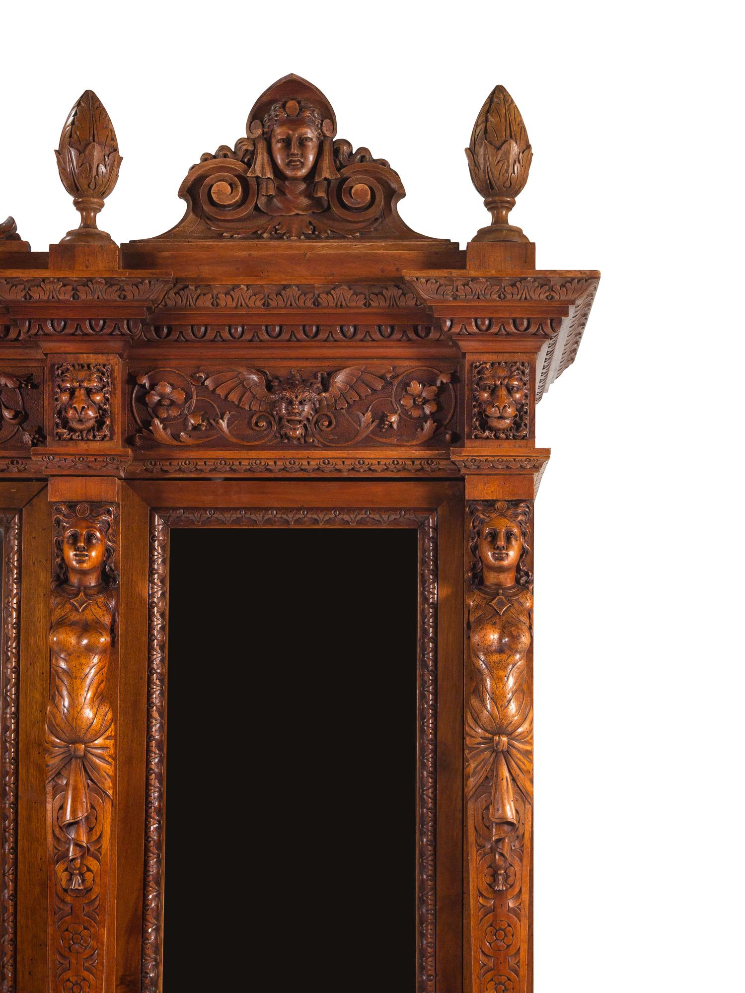 An Italian Renaissance Style Carved Walnut Cabinet