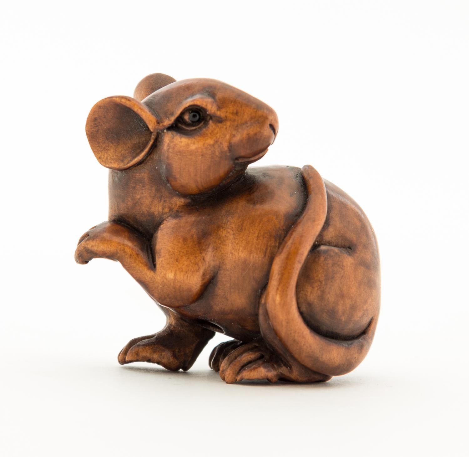 A Japanese Carved Boxwood Animal Form Netsuke Height 1 1/2 inches.