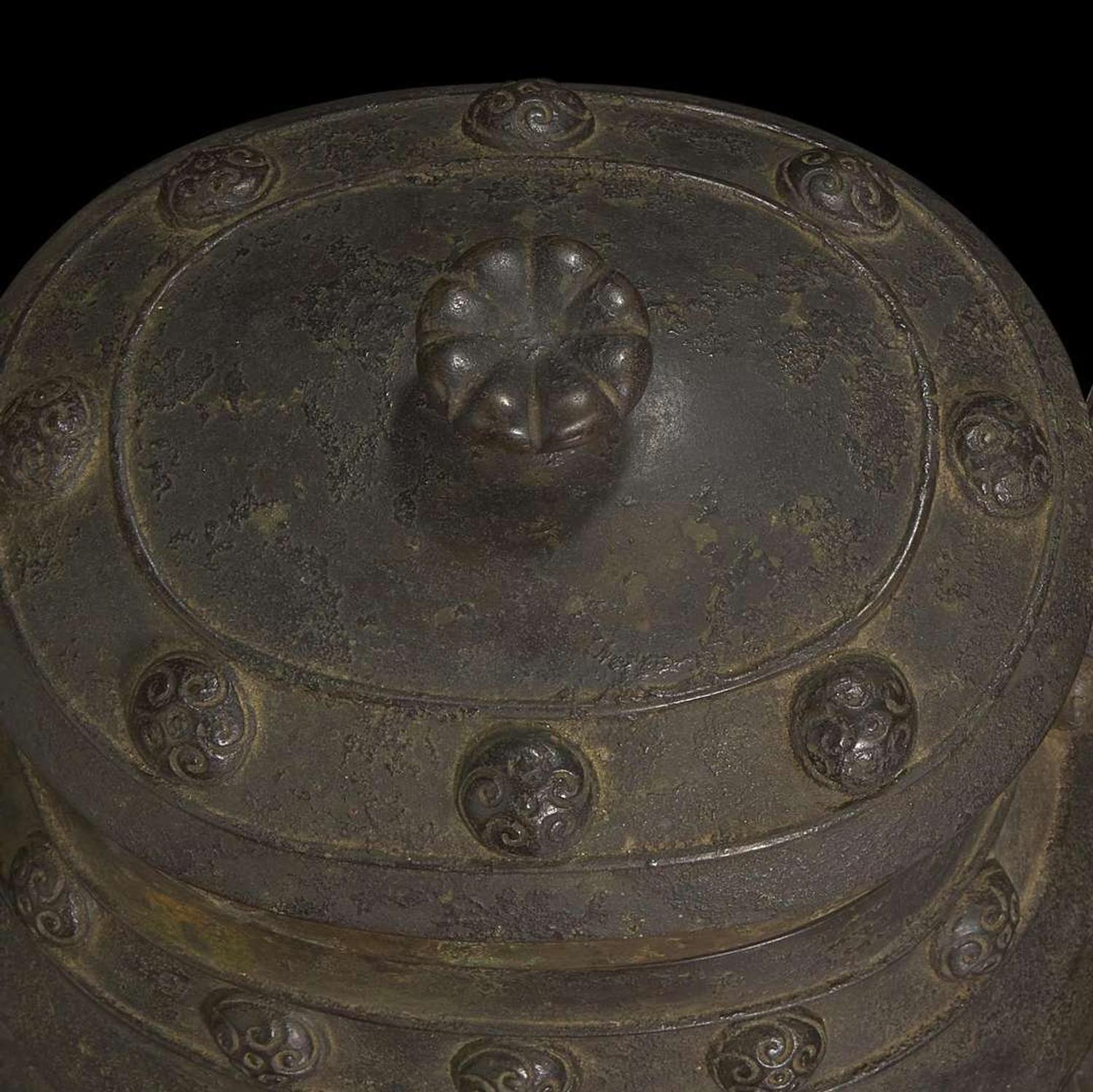 A Chinese patinated bronze archaistic vessel and cover, you 复古风格铜提梁卣