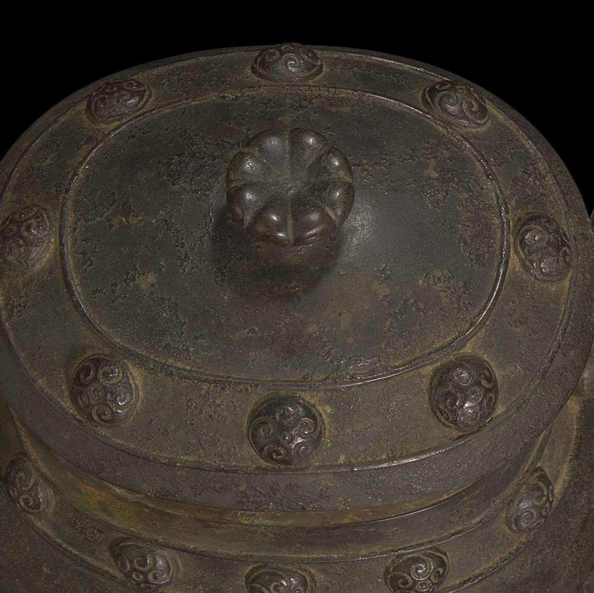A Chinese patinated bronze archaistic vessel and cover, you 复古风格铜提梁卣