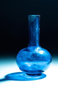 A Chinese Transparent Peacock-Blue Glass Bottle Vase